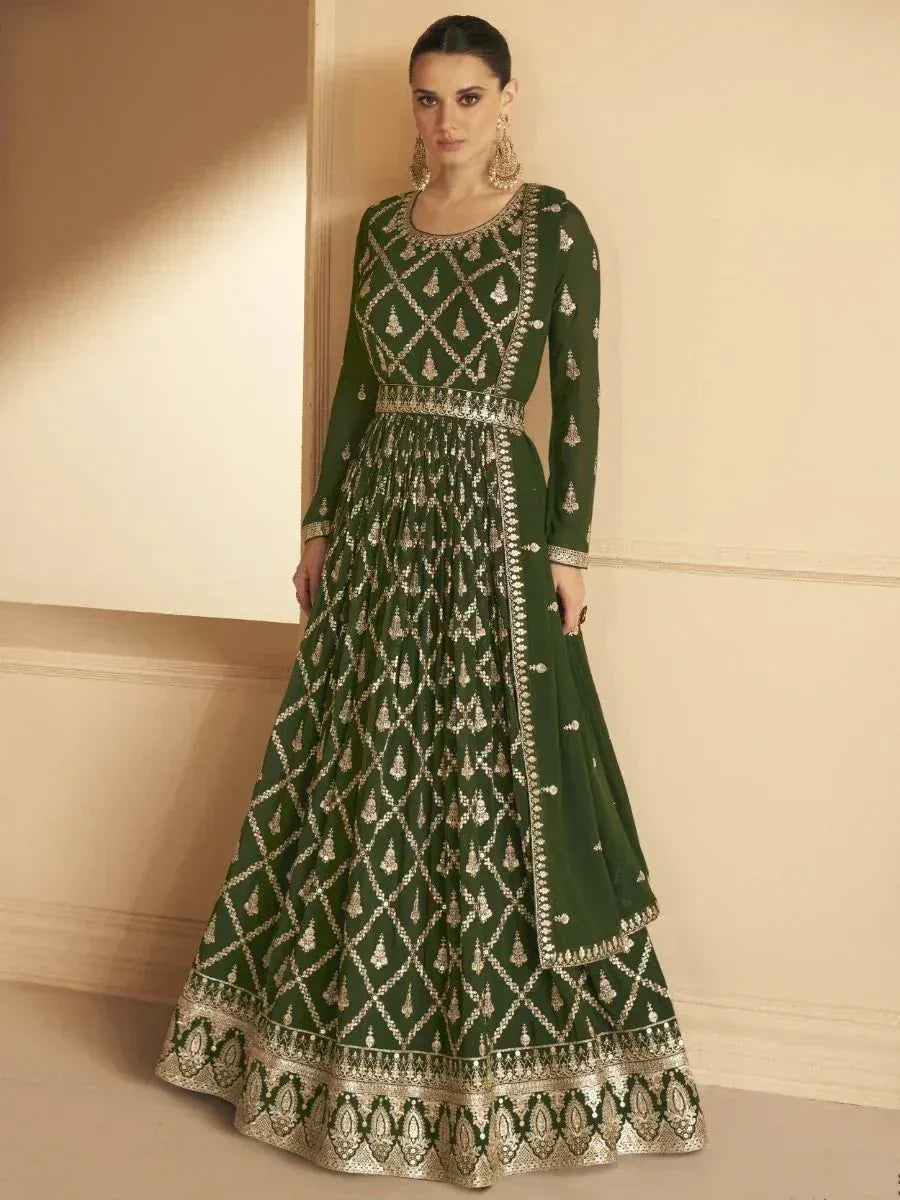 Emerald green embroidered anarkali gown with gold detailing, perfect for Indian ethnic wear occasions.