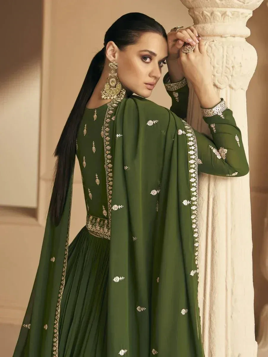 Elegant green embroidered salwar kameez with gold detailing, perfect for festive occasions and ethnic wear.