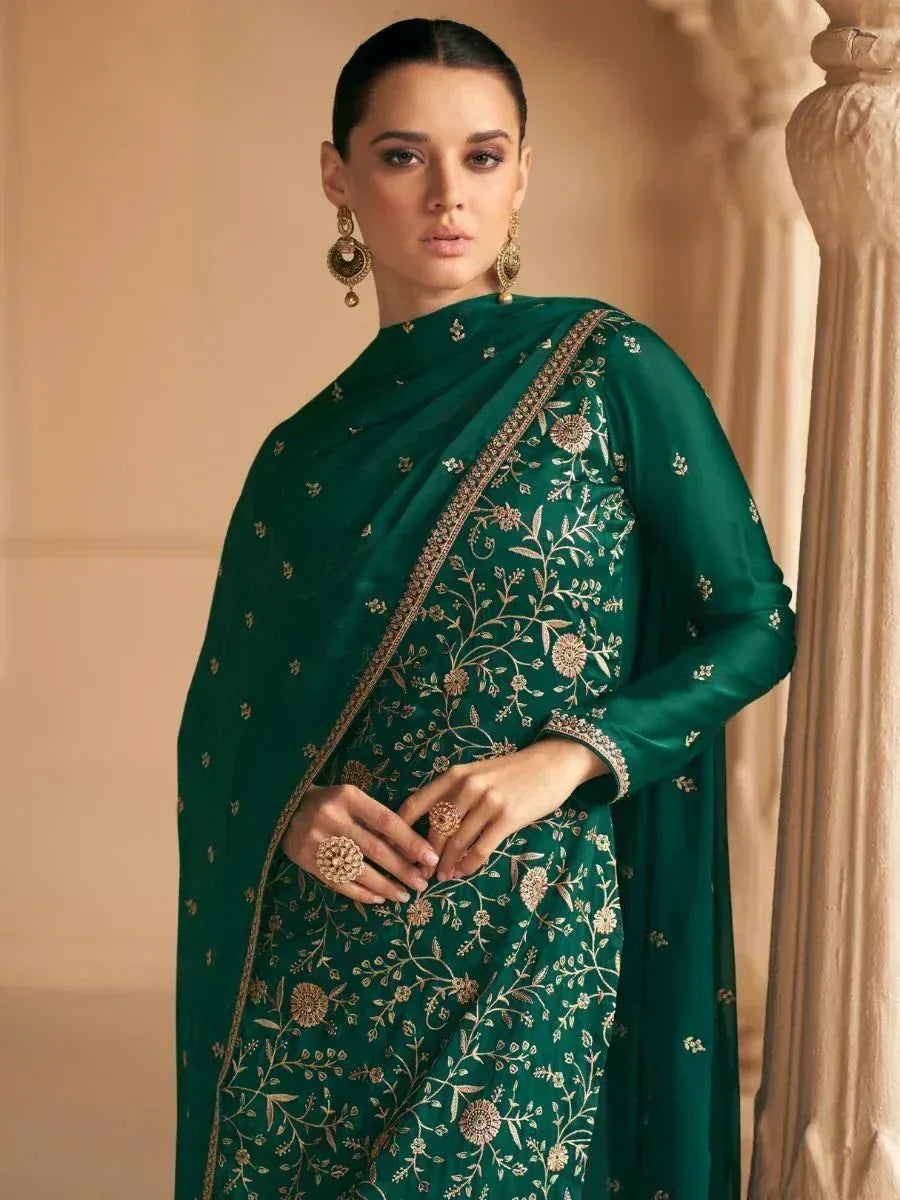 Emerald green embroidered saree with gold floral motifs, perfect for Indian ethnic occasions