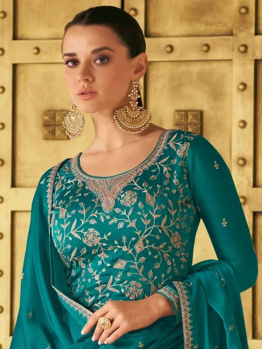 Teal embroidered salwar kameez with gold detailing, perfect for Indian ethnic wear occasions