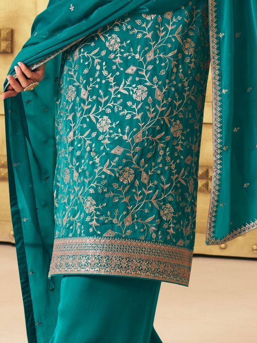 Teal ethnic salwar kameez with gold floral embroidery and matching dupatta, perfect for Indian occasions