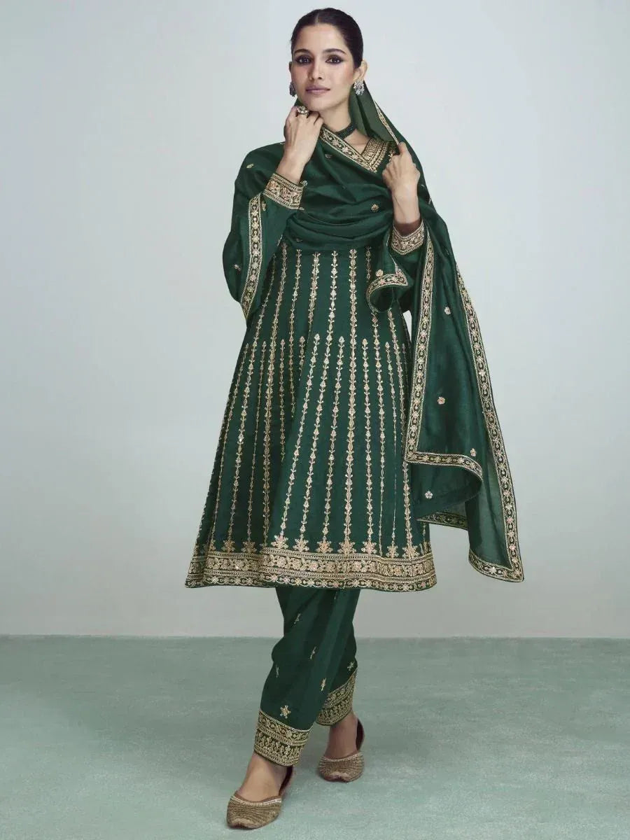 Emerald green embroidered salwar kameez with gold detailing, perfect for Indian ethnic wear occasions.