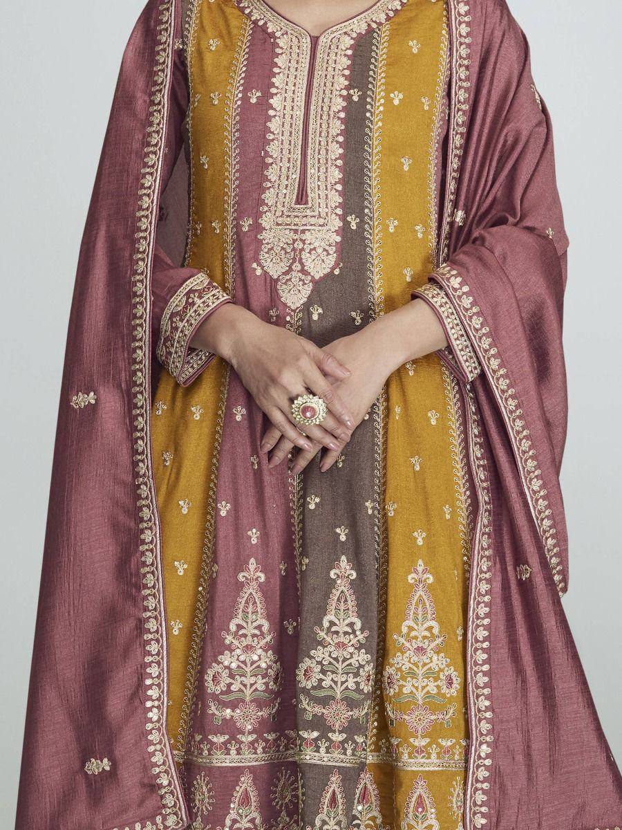Elegant Indian ethnic salwar kameez with gold and maroon embroidery, perfect for festive occasions
