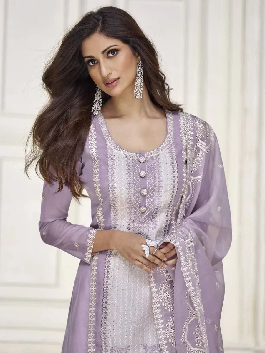 Lavender embroidered salwar kameez with white lace detailing, perfect for ethnic occasions