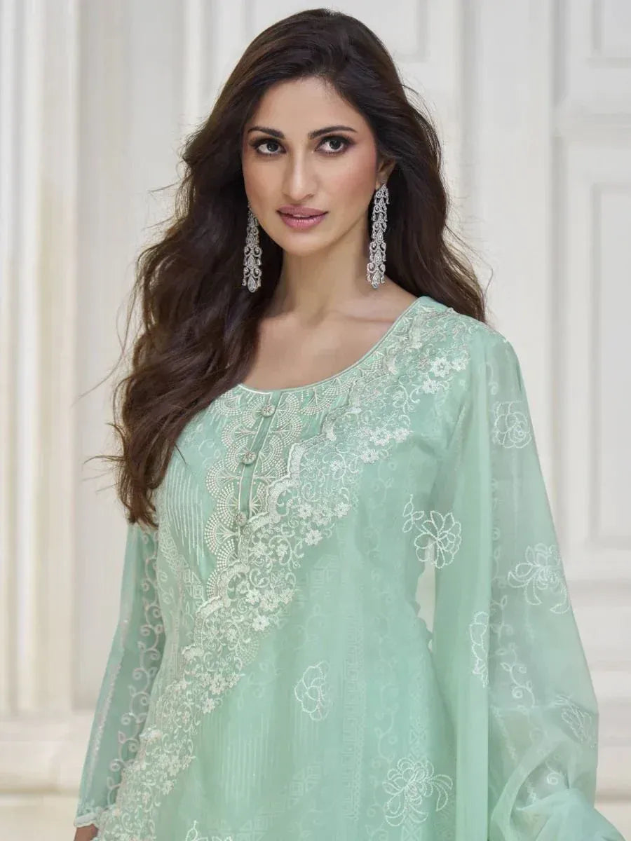 Mint green embroidered ethnic kurti with floral lace detailing, perfect for Indian festive wear