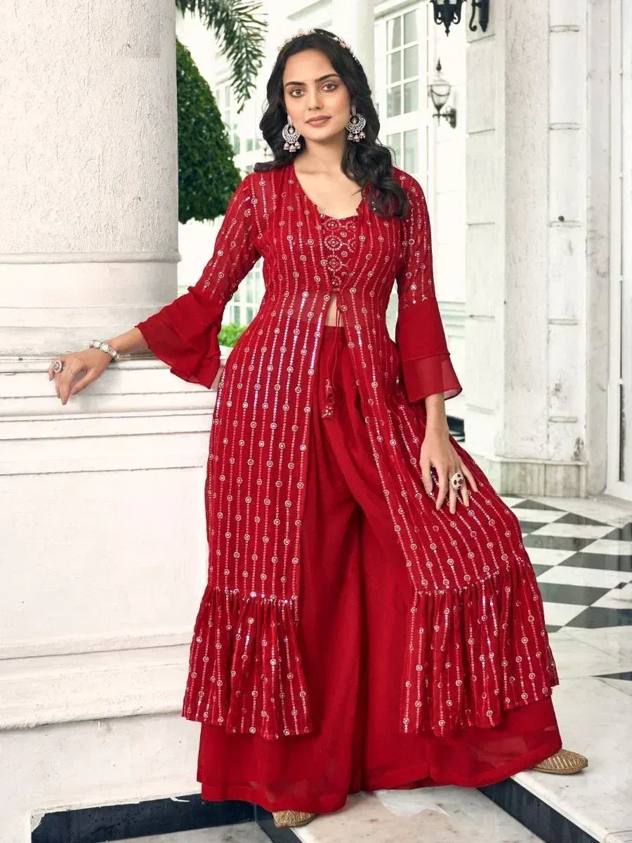 Woman wearing red embroidered ethnic gown set with flared sleeves and palazzo pants
