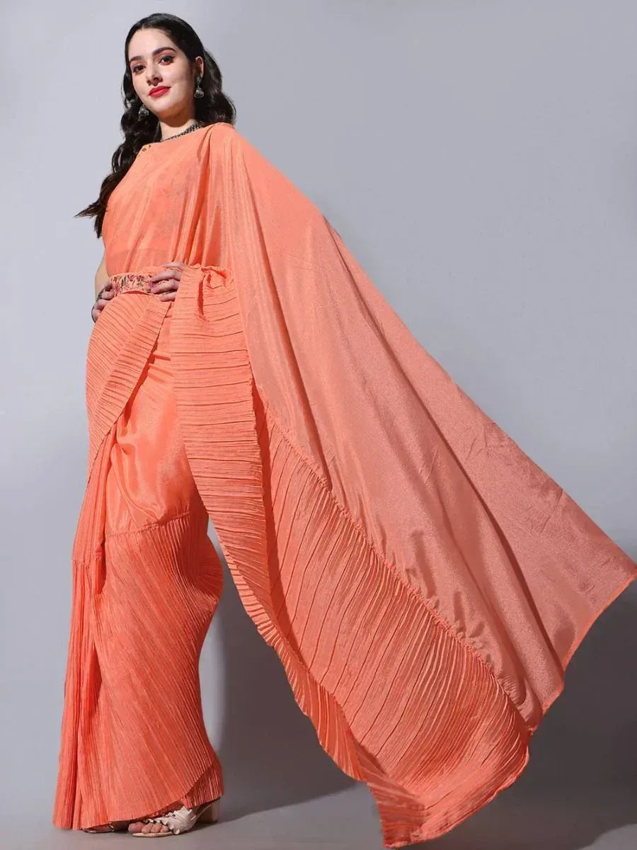 Orange pleated saree with flowing drape, stylish ethnic wear for women