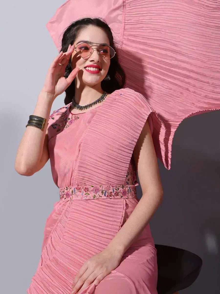 Pink pleated ethnic gown with floral embroidery, perfect for Indian occasions and festive wear.