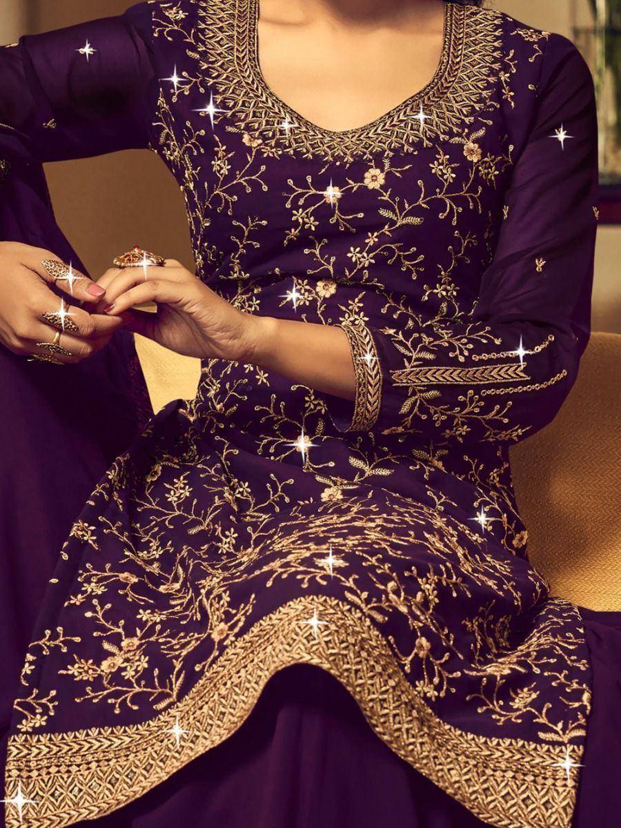 Purple ethnic gown with gold floral embroidery, perfect for Indian weddings and festive occasions.
