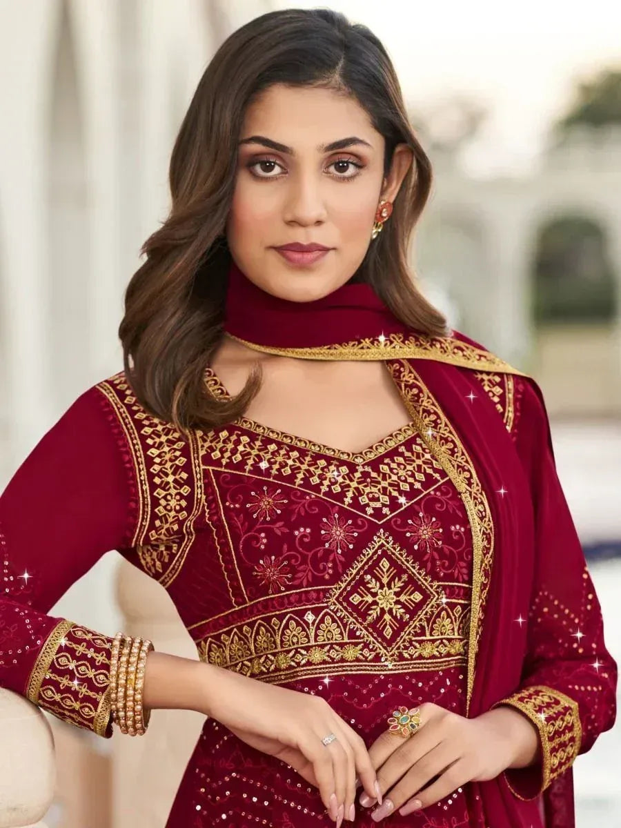 Maroon ethnic salwar kameez with gold embroidery and sequins, perfect for Indian festive occasions