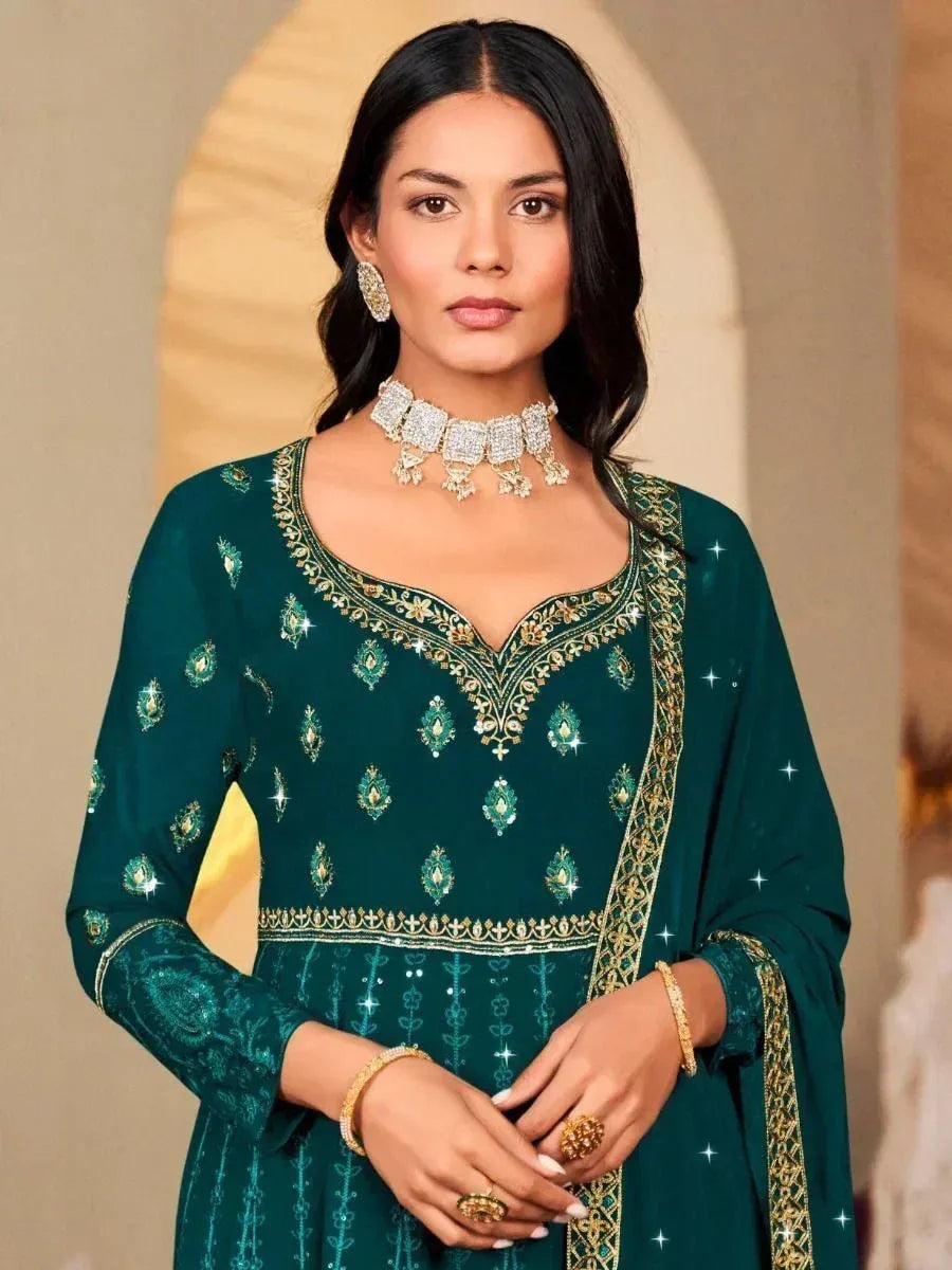 Emerald green embroidered salwar kameez with gold detailing, perfect for Indian ethnic wear occasions.