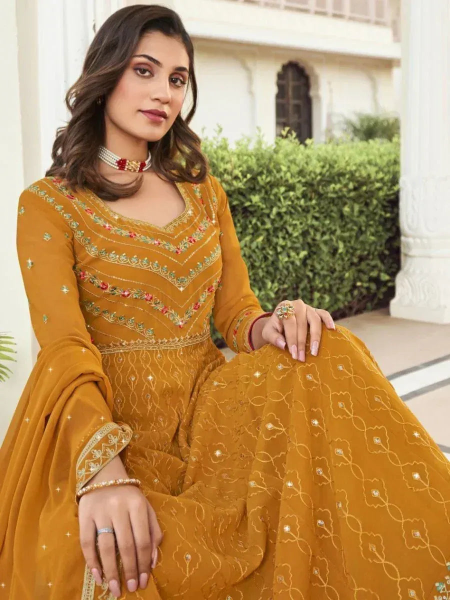 Mustard yellow embroidered anarkali suit with floral detailing, perfect for Indian ethnic occasions