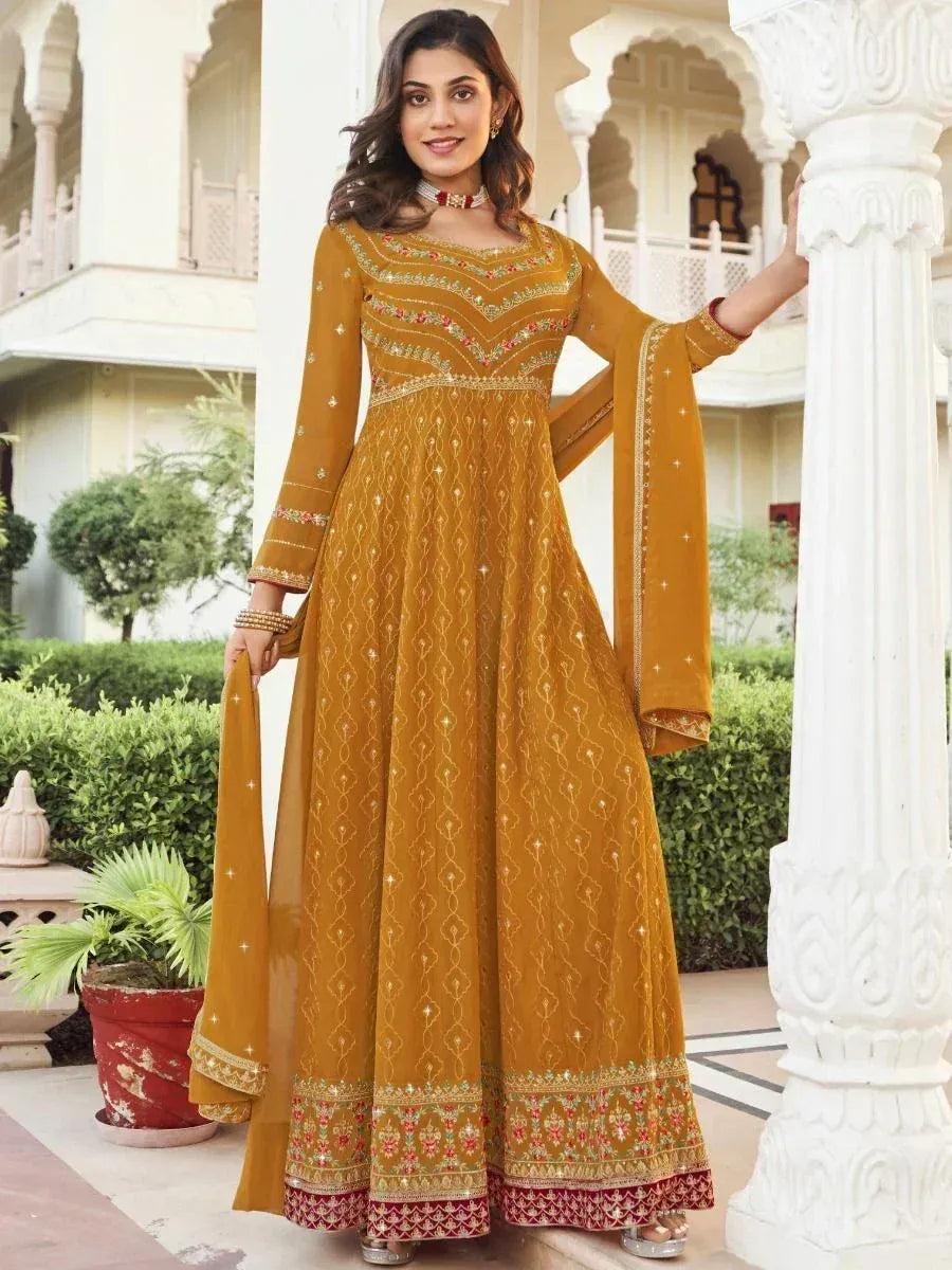 Mustard yellow embroidered anarkali suit with floral detailing, perfect for Indian ethnic occasions