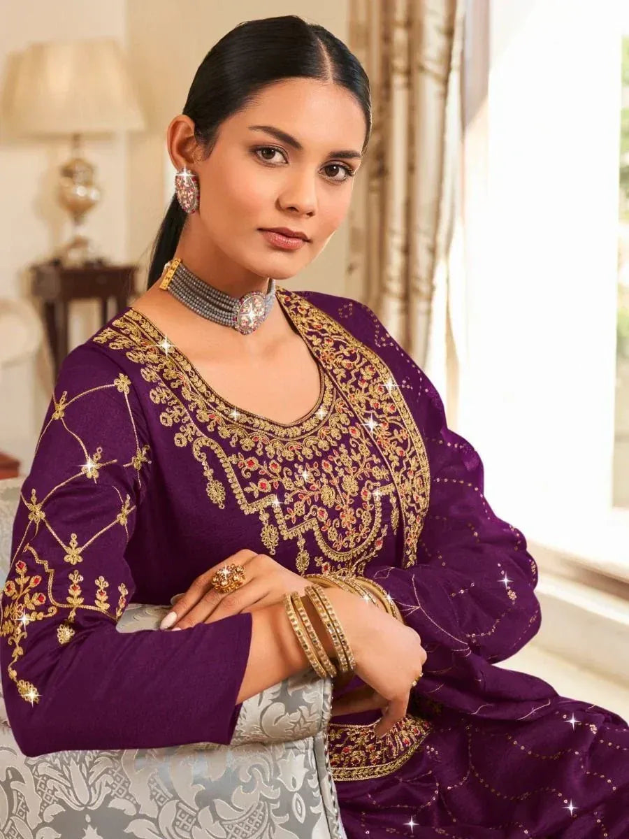 Purple embroidered ethnic salwar kameez with gold detailing, perfect for festive occasions