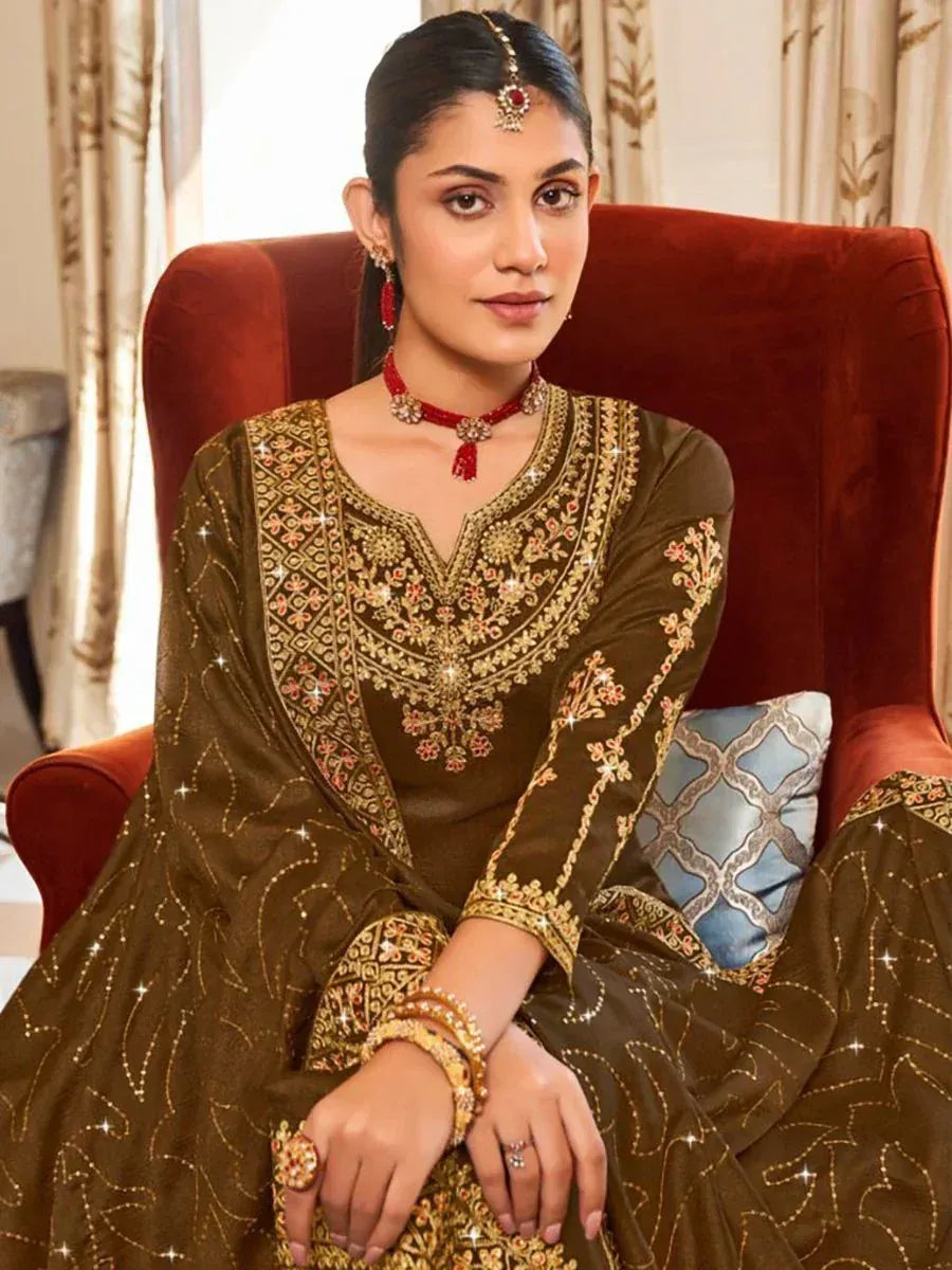 Elegant olive green embroidered ethnic gown with gold detailing, perfect for Indian weddings and festive occasions.