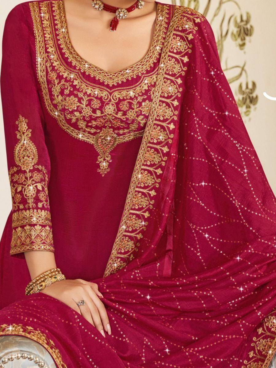 Maroon ethnic salwar kameez with gold embroidery and sequin dupatta, perfect for Indian festive occasions