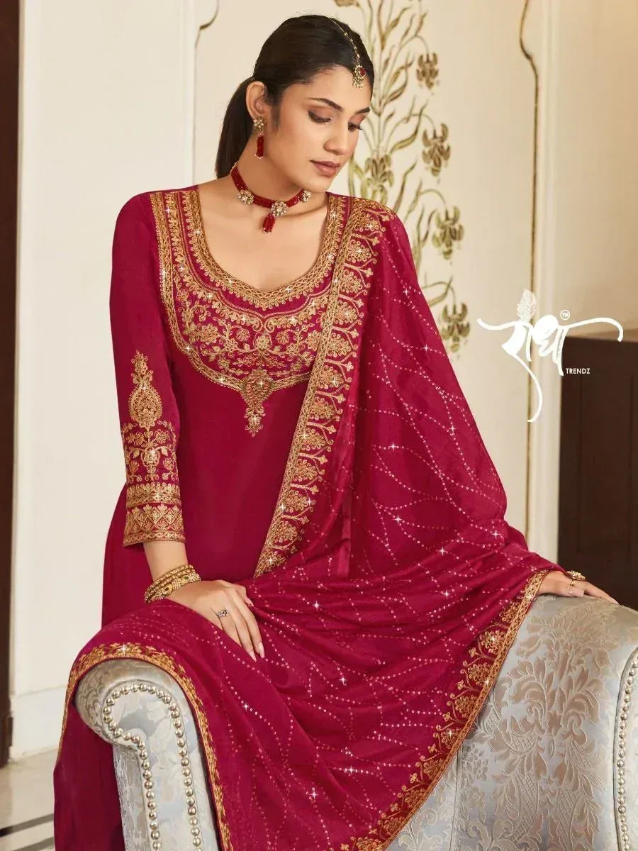 Maroon designer salwar kameez with gold embroidery and sequin work, perfect for ethnic occasions