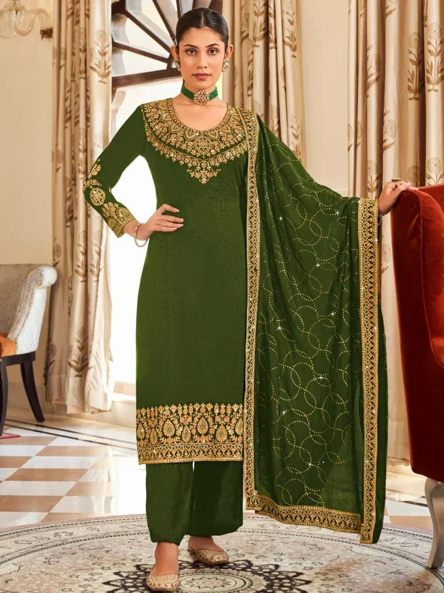 Woman wearing green embroidered salwar kameez with dupatta, traditional Indian ethnic wear