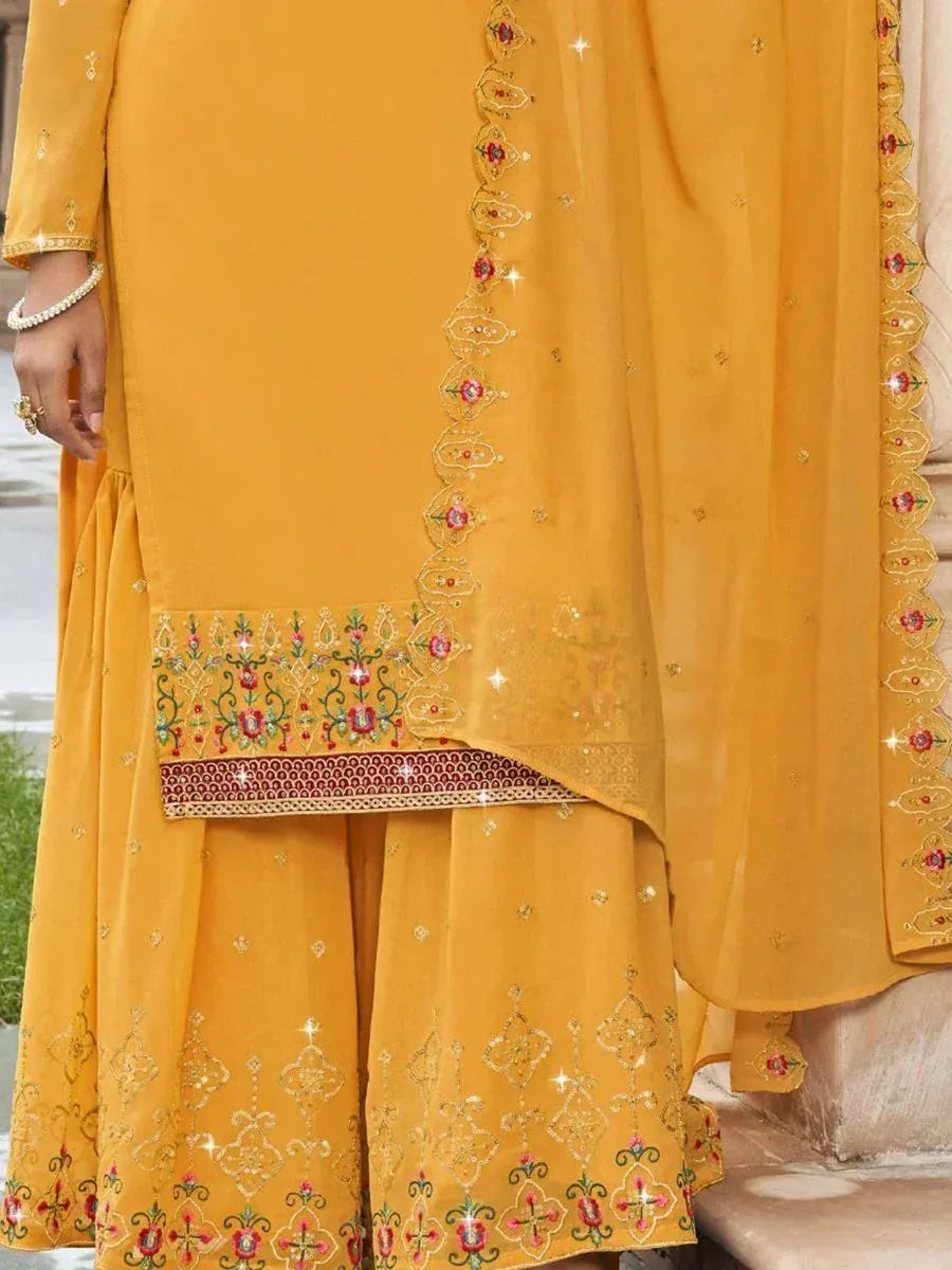 Mustard yellow embroidered Indian salwar kameez with floral and sequin detailing