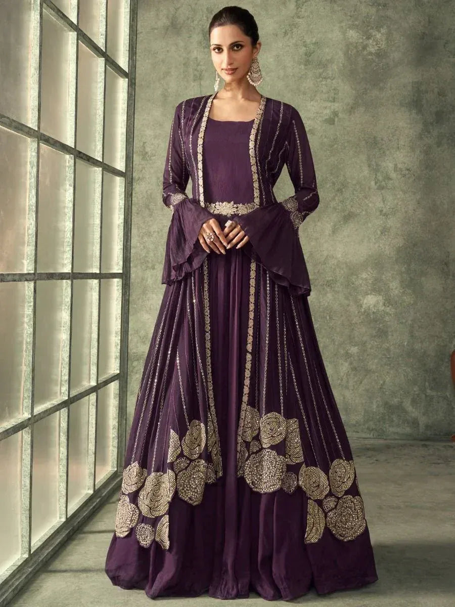 Elegant purple ethnic gown with gold floral embroidery, perfect for Indian weddings and festive occasions.