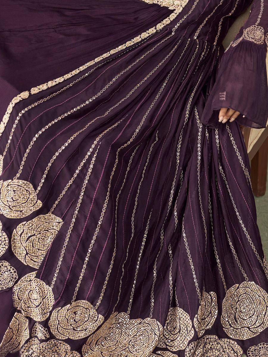 Purple ethnic gown with gold floral embroidery and chain detailing, perfect for Indian festive occasions