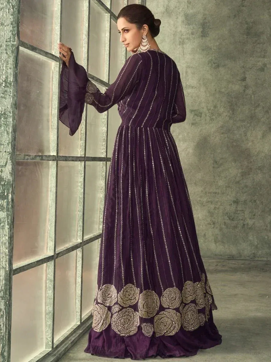 Purple ethnic gown with gold floral embroidery and bell sleeves, perfect for Indian occasions