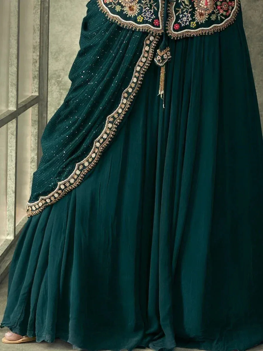 Emerald green designer lehenga choli with floral embroidery and gold trim, perfect for Indian ethnic wear.