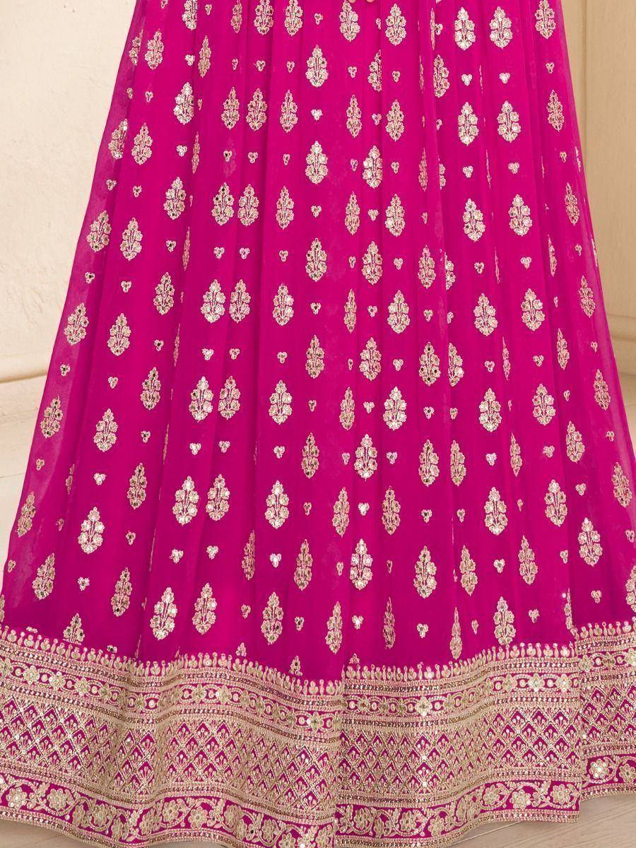 Fuchsia lehenga skirt with gold floral embroidery and detailed border, ideal for Indian ethnic wear