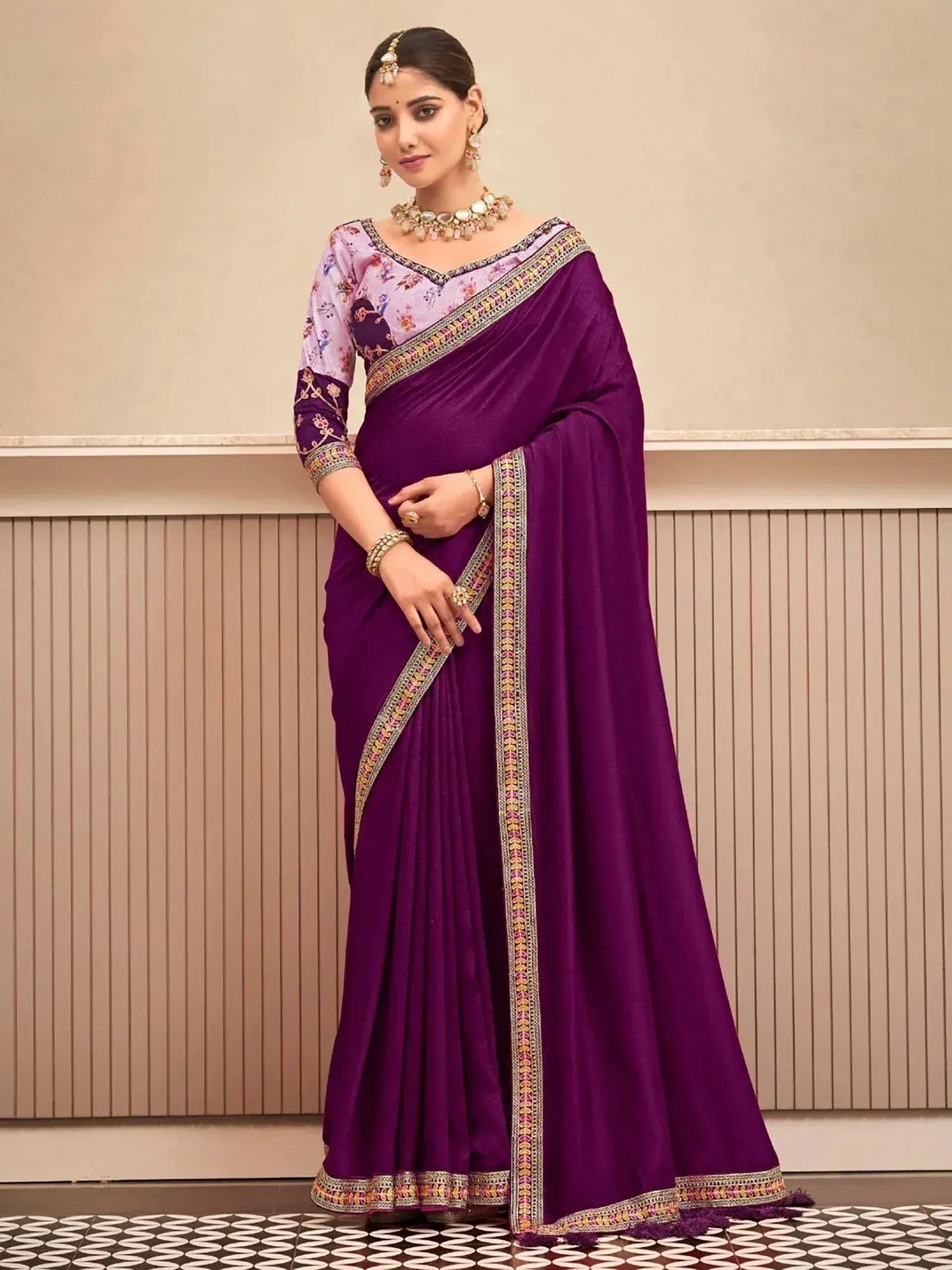 Purple ethnic saree with floral blouse and embroidered border, perfect for Indian occasions