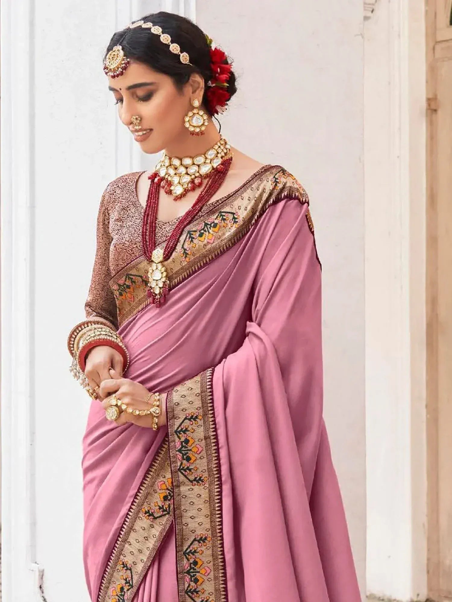 Pink embroidered saree with gold border, traditional Indian ethnic wear, designer jewelry
