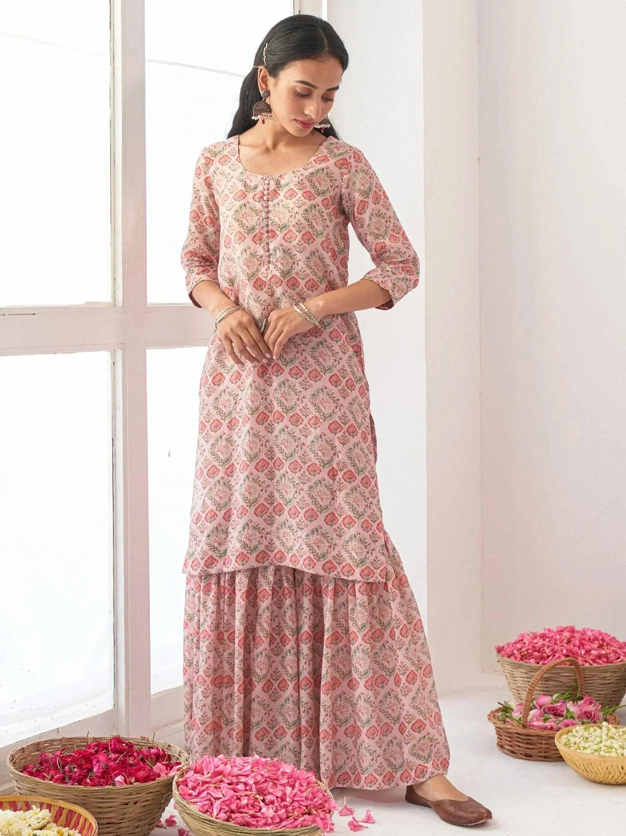 Pink floral printed kurta with palazzo pants, Indian ethnic wear for women, styled with jhumka earrings and floral baskets