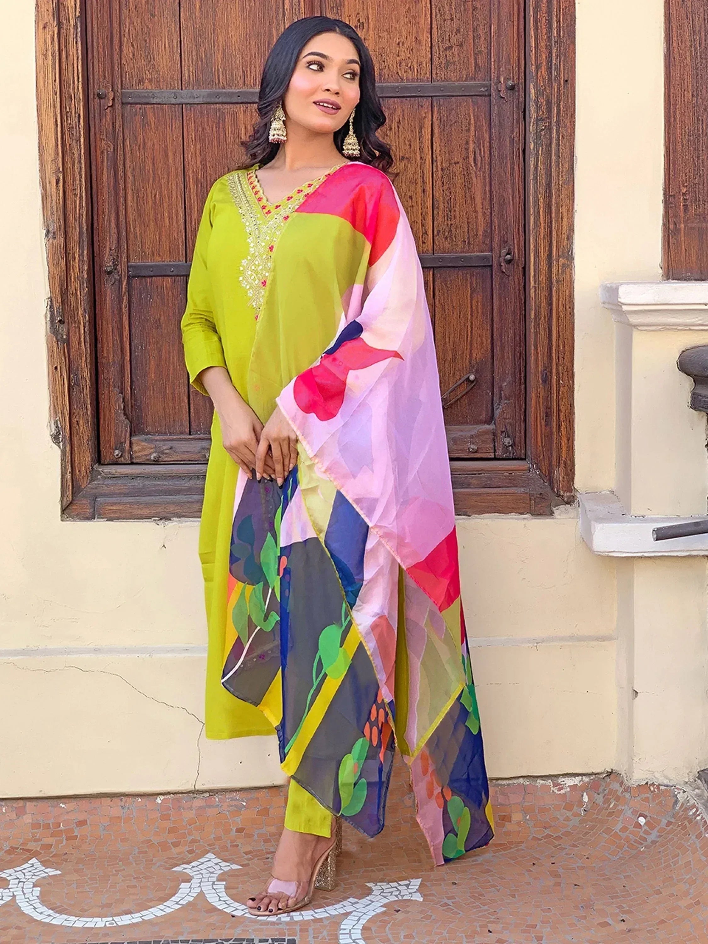 Vibrant green embroidered kurta with colorful printed dupatta, styled with palazzo pants for ethnic wear.