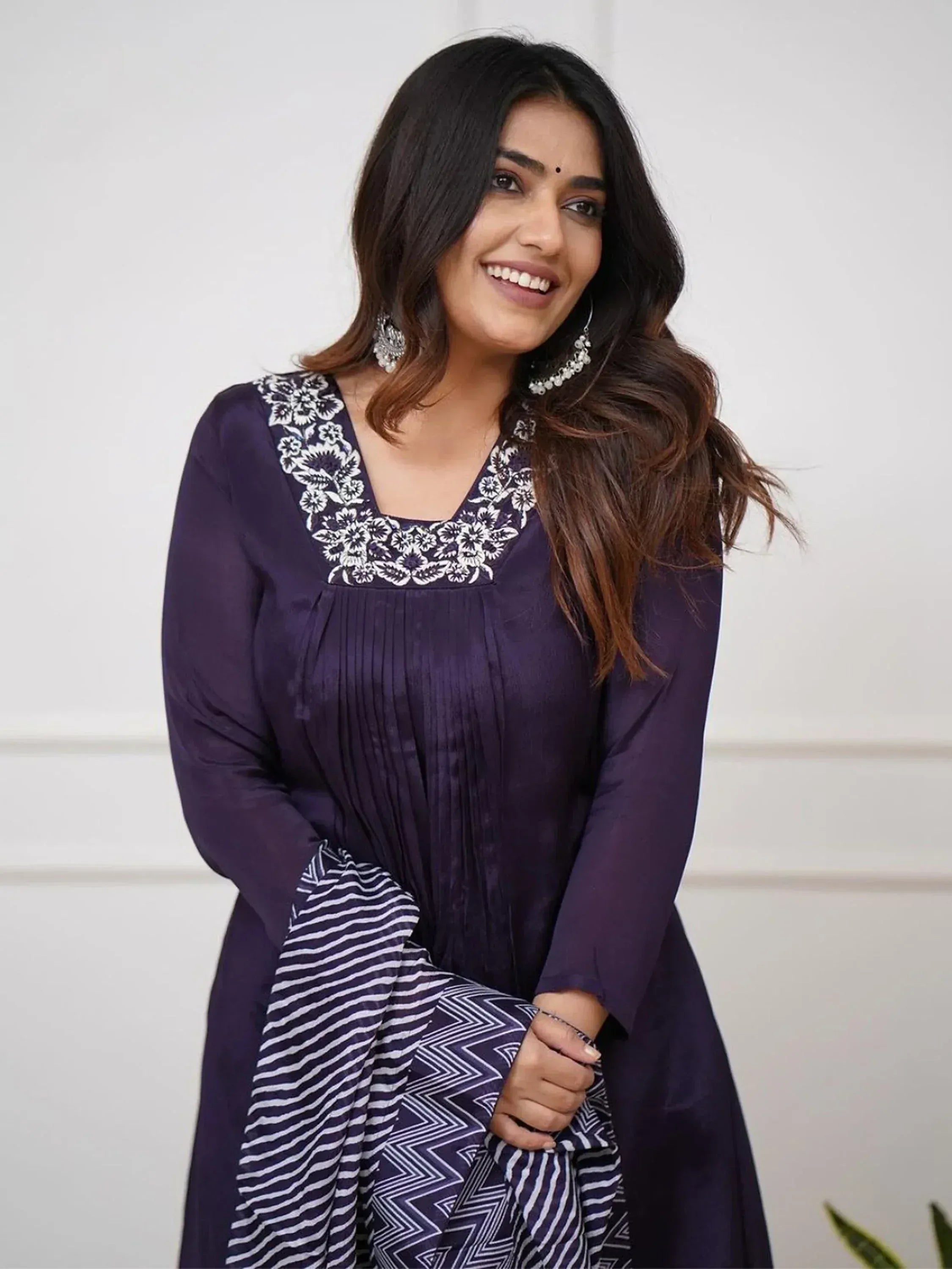 Purple ethnic gown with floral embroidery and geometric dupatta, perfect for Indian festive wear