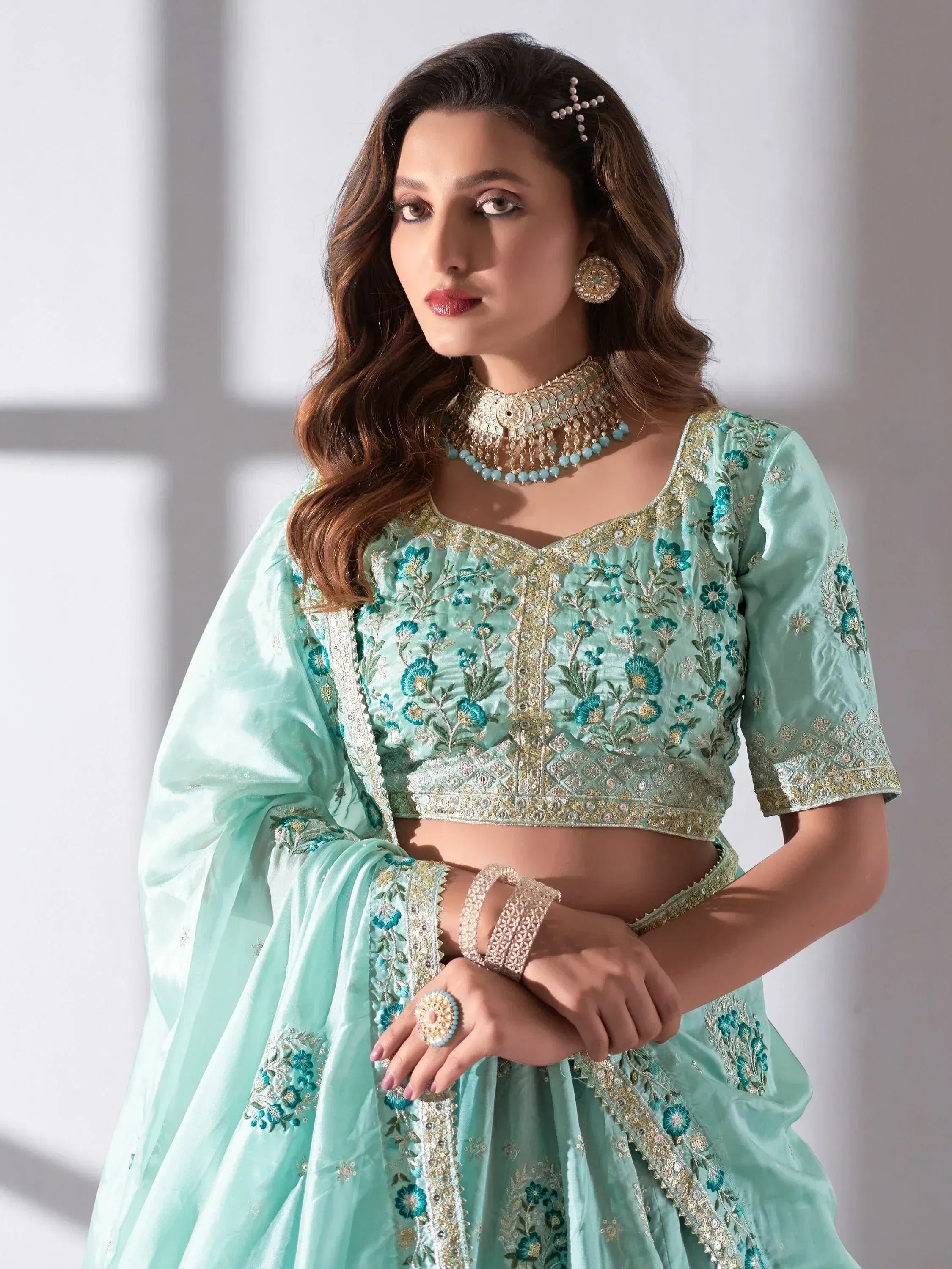 Mint green embroidered lehenga choli with floral zari work, perfect for Indian ethnic occasions