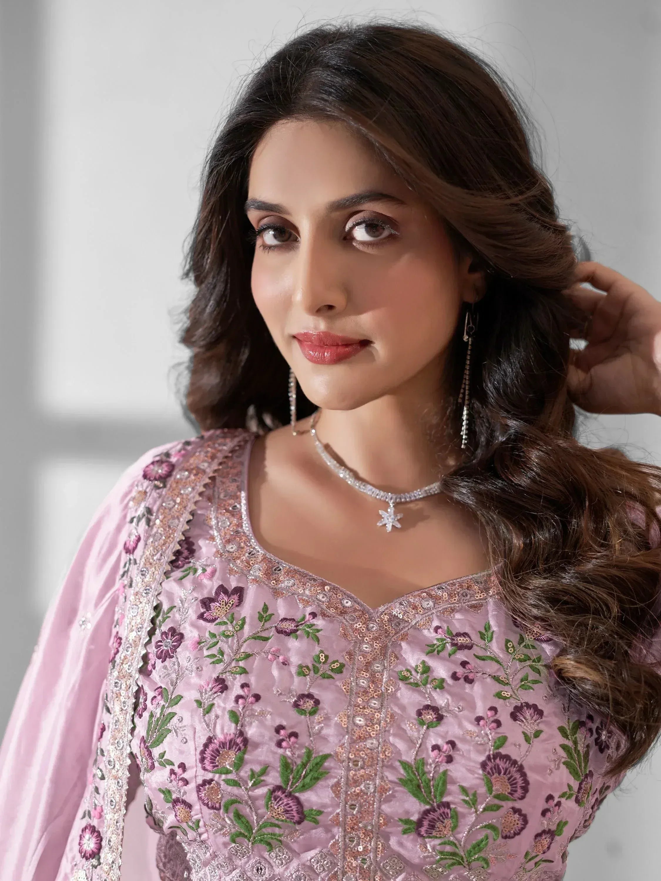 Pink floral embroidered ethnic gown with sequin detailing, perfect for Indian occasions