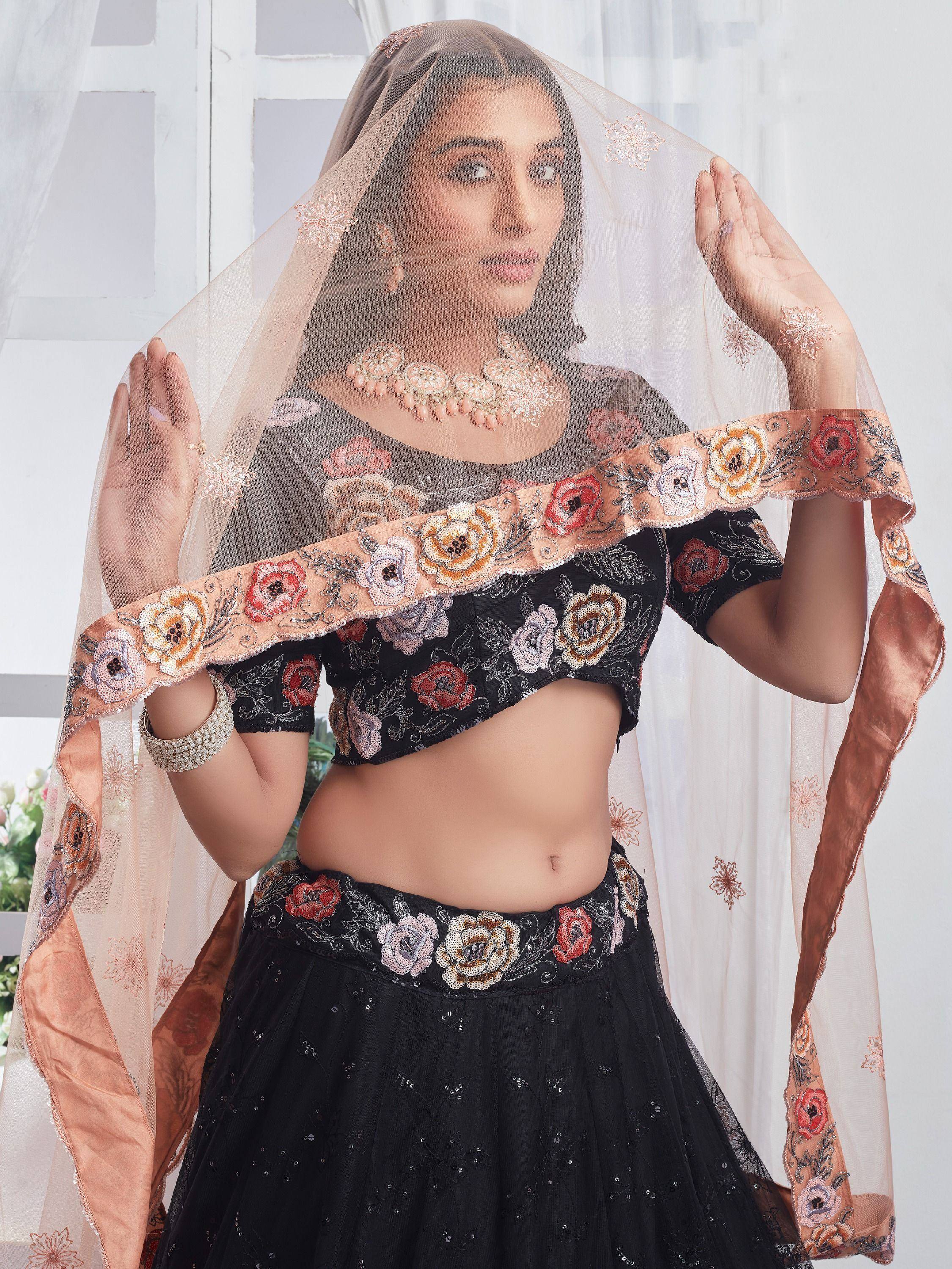 Black floral embroidered lehenga choli with peach dupatta, perfect for Indian ethnic wear occasions