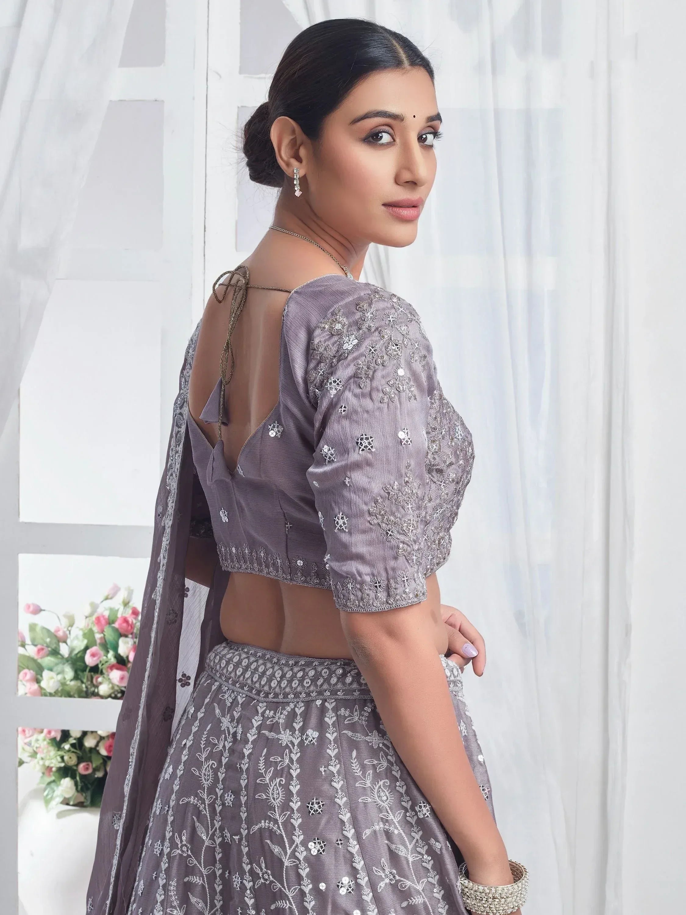 Grey embroidered lehenga choli with open back blouse, perfect for Indian ethnic wear occasions