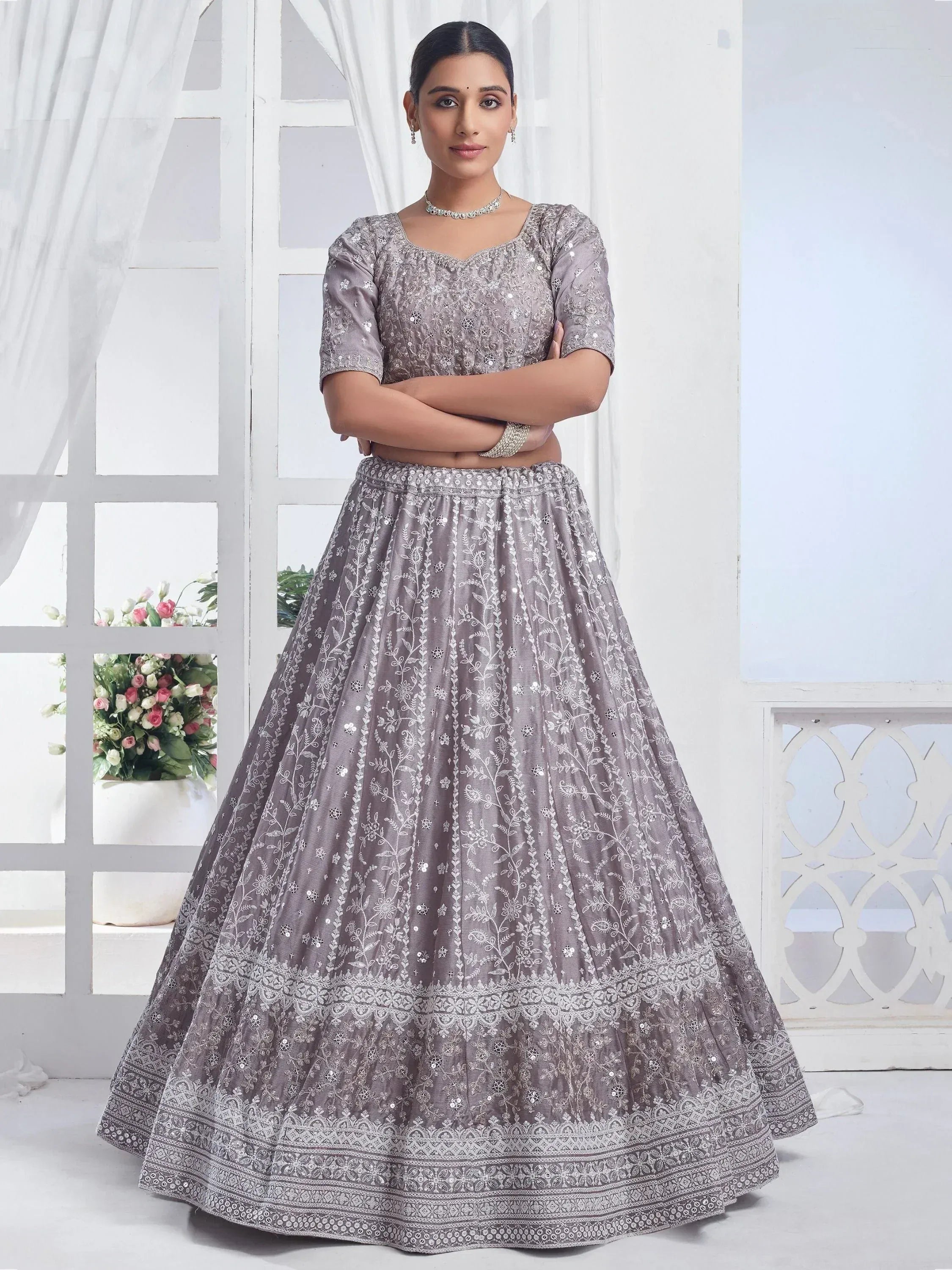 Elegant grey embroidered lehenga choli with floral patterns and sequin detailing, perfect for Indian ethnic wear.