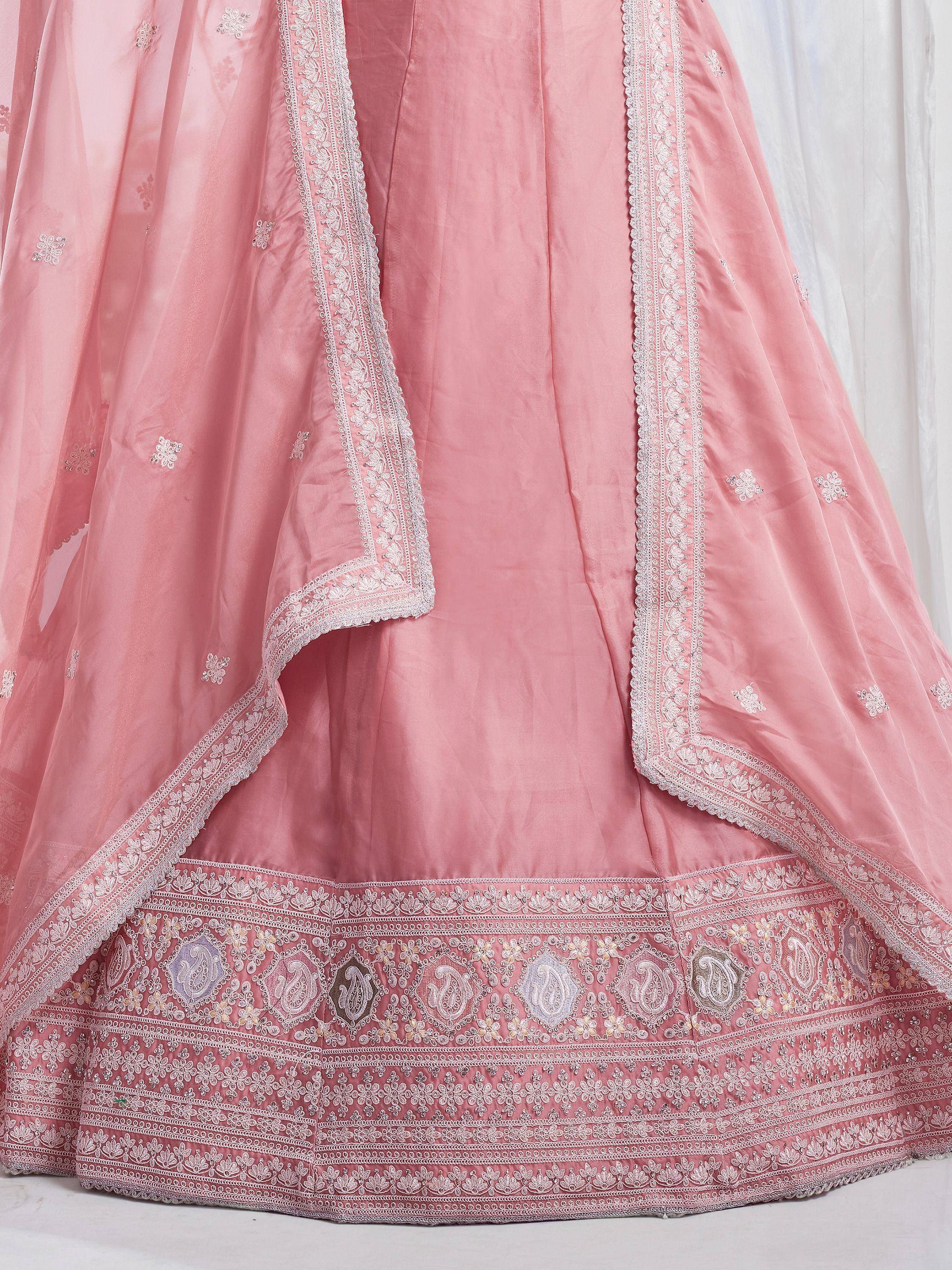 Pink designer lehenga choli with intricate embroidery and floral motifs, perfect for Indian ethnic wear.