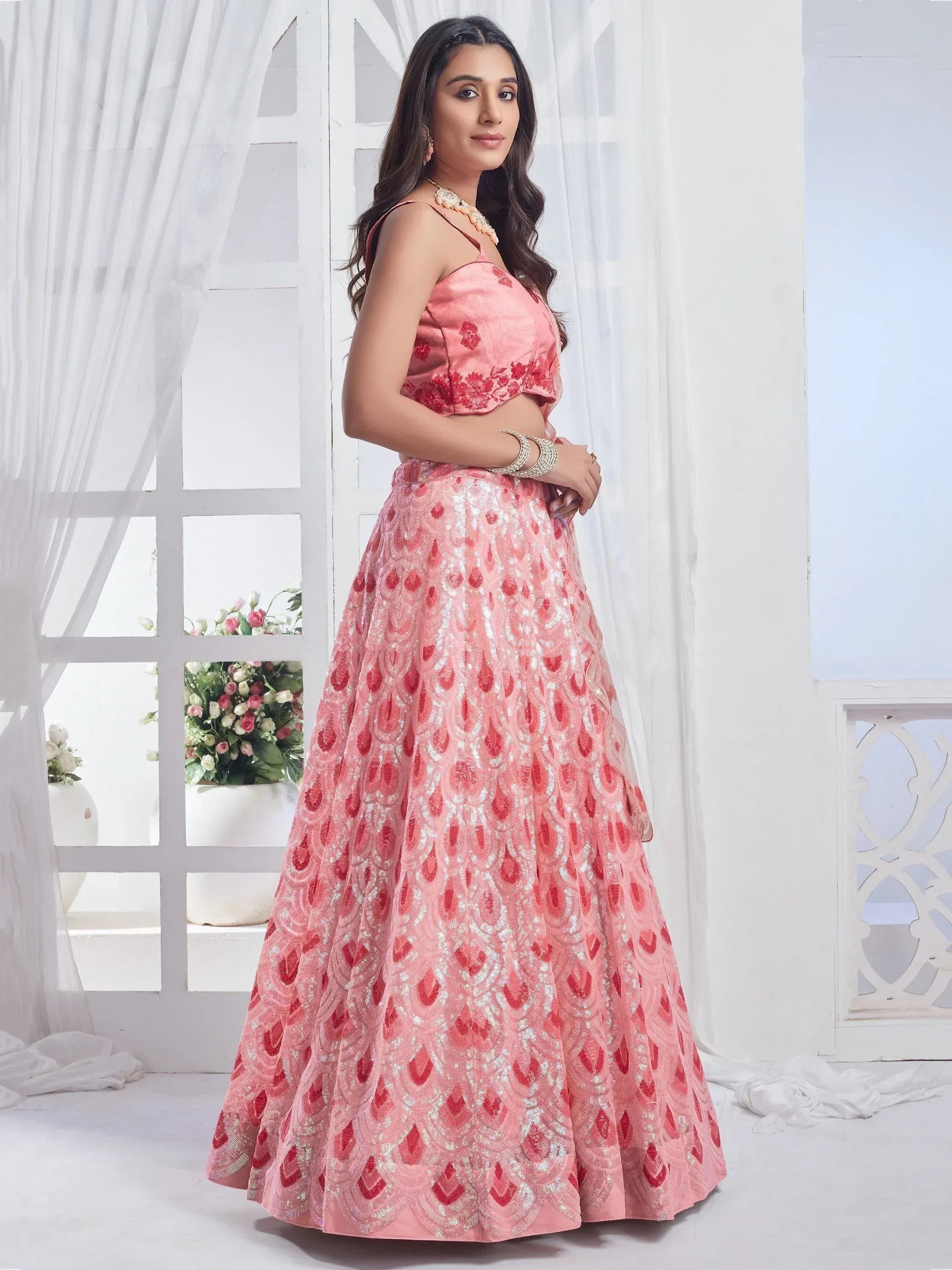 Pink embroidered lehenga choli with floral blouse, perfect for Indian weddings and festive occasions