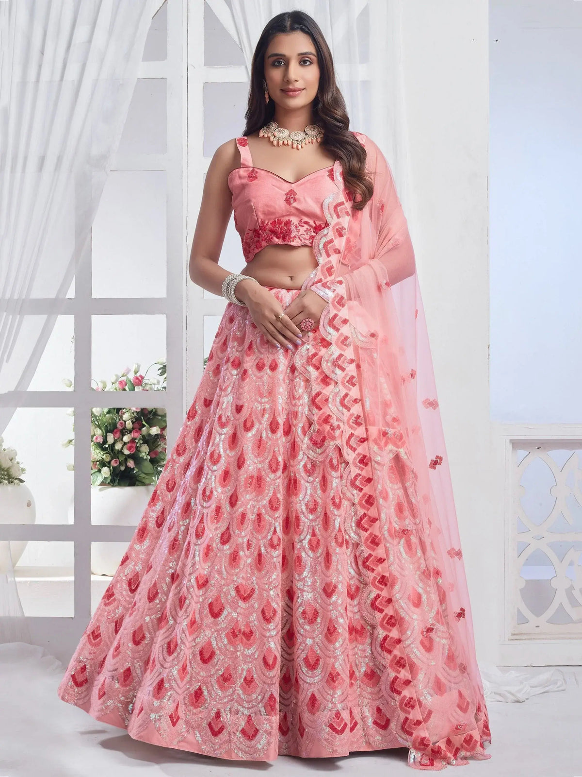 Fascinating Baby Pink Sequins Net Engagement Wear Lehenga Choli
