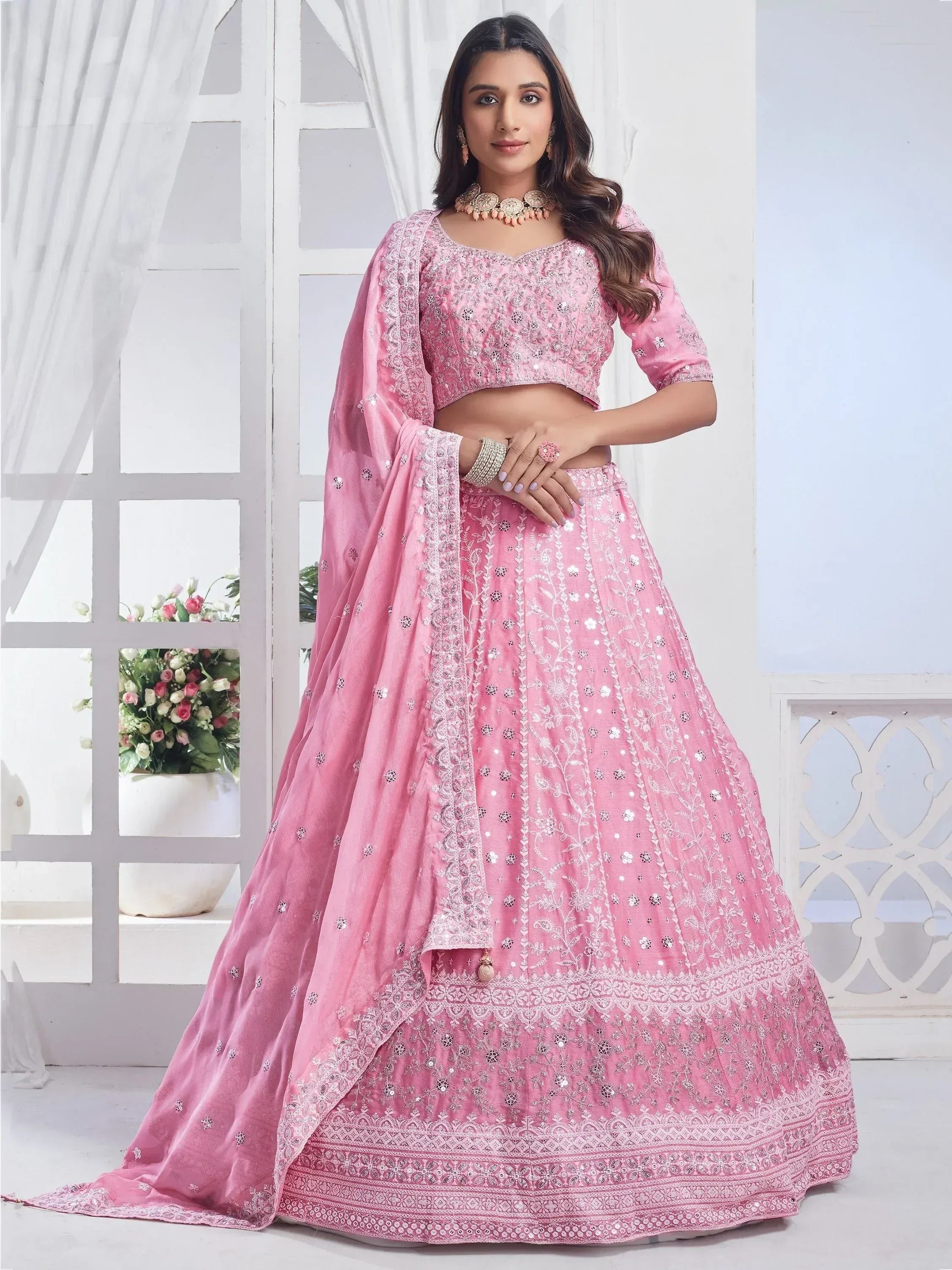 Pink embroidered lehenga choli with mirror work, perfect for Indian ethnic wear and festive occasions