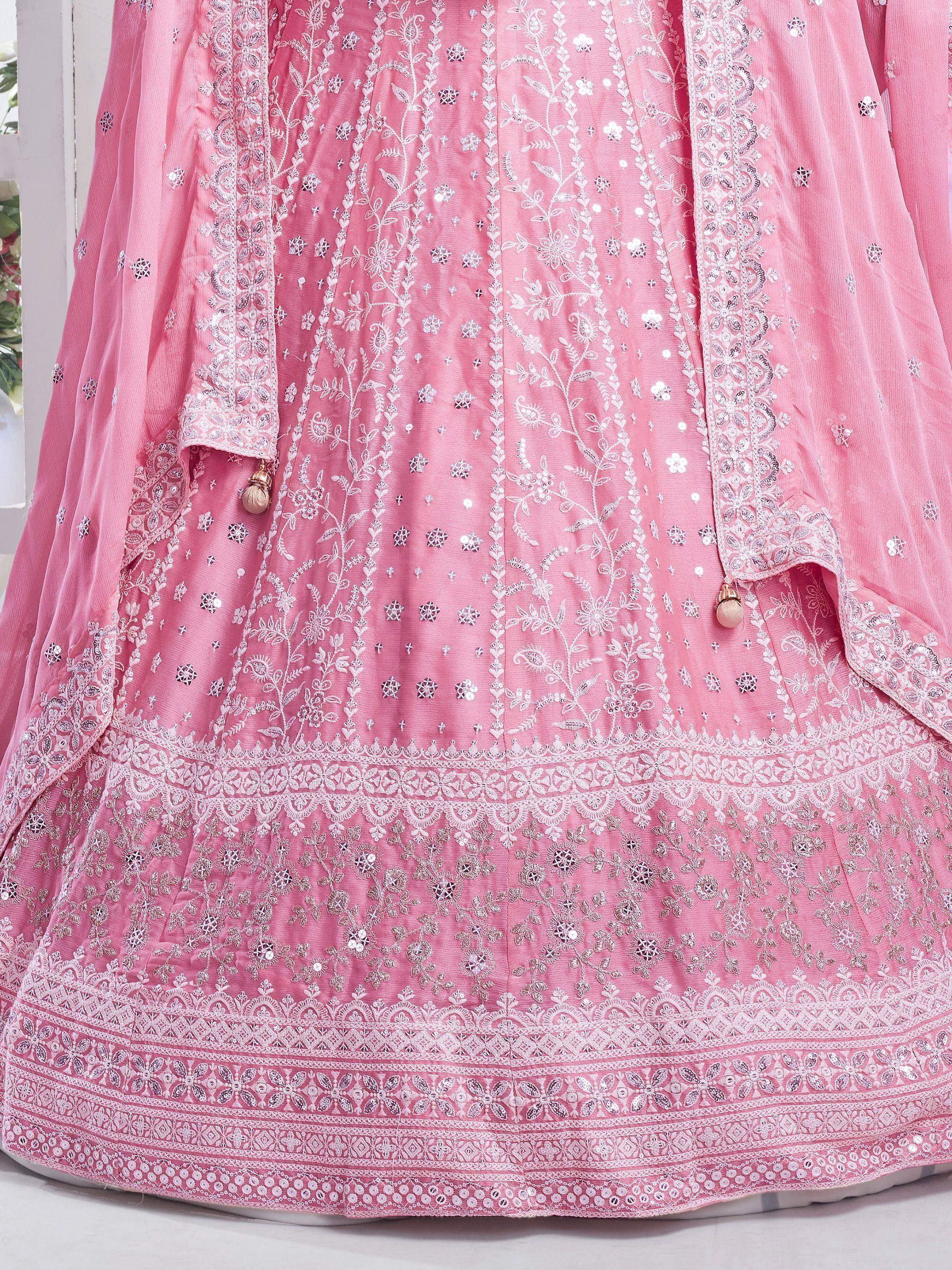 Pink designer lehenga choli with intricate white embroidery and mirror work, perfect for Indian ethnic wear.