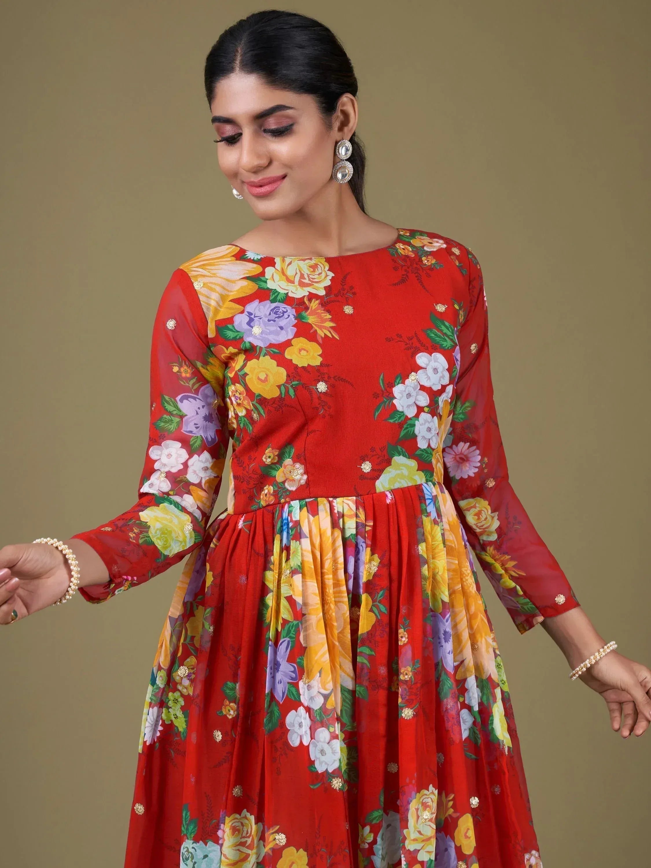 Red floral ethnic gown with long sleeves and pleated skirt, perfect for Indian occasions