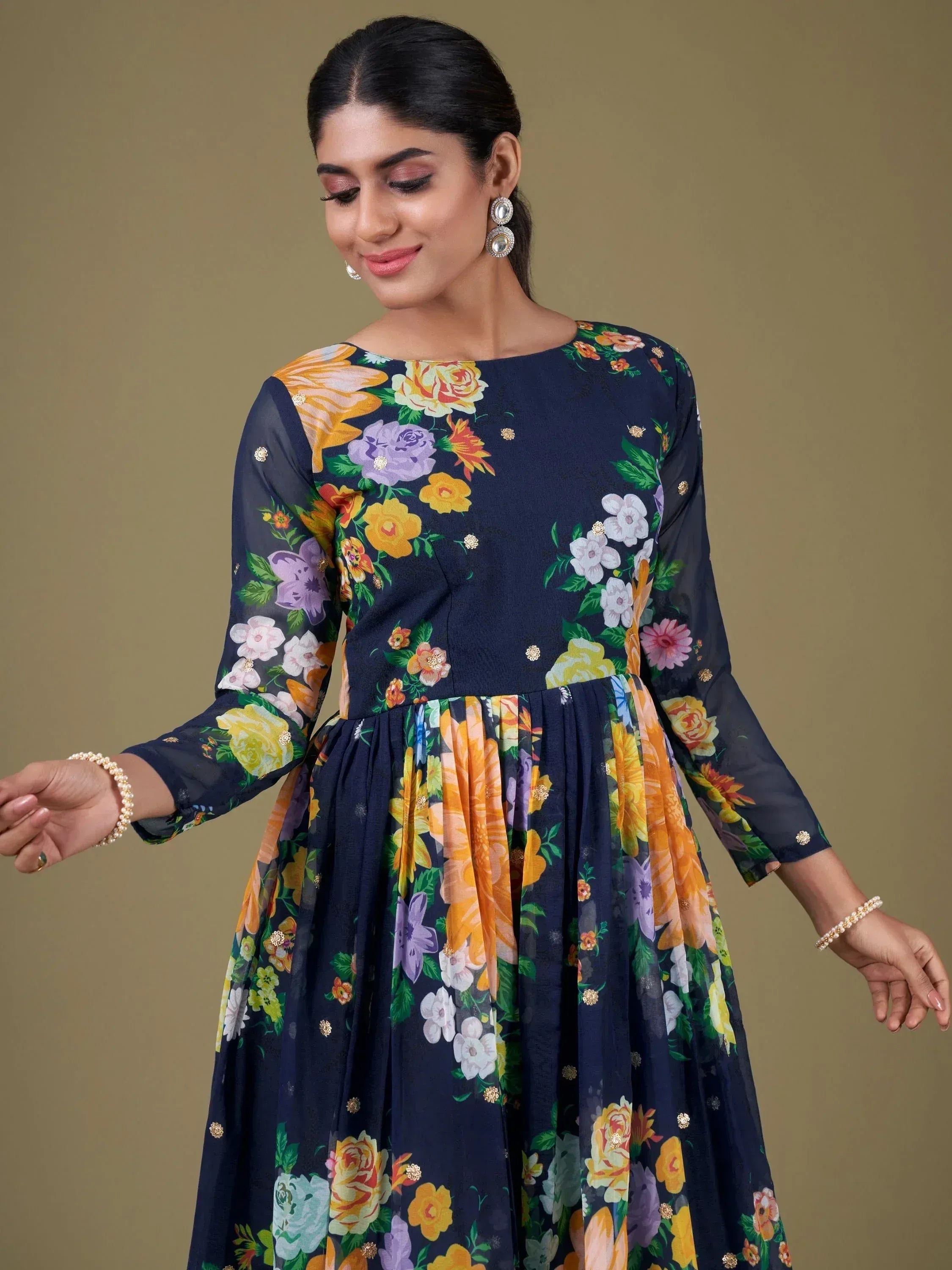 Navy floral print ethnic gown with sheer sleeves and gold embellishments, perfect for Indian occasions