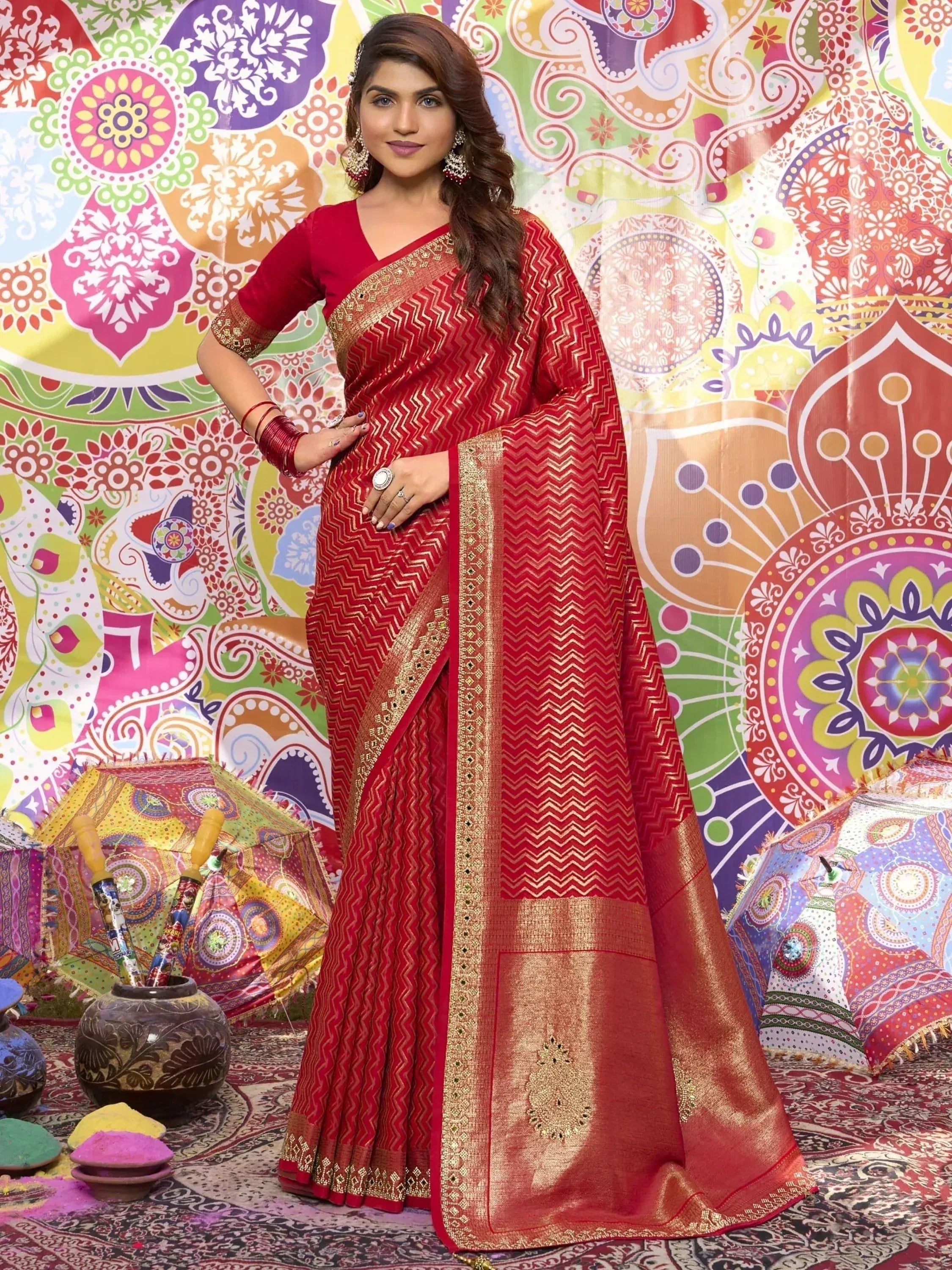 Red ethnic saree with gold zigzag pattern, perfect for festive occasions and Indian celebrations.