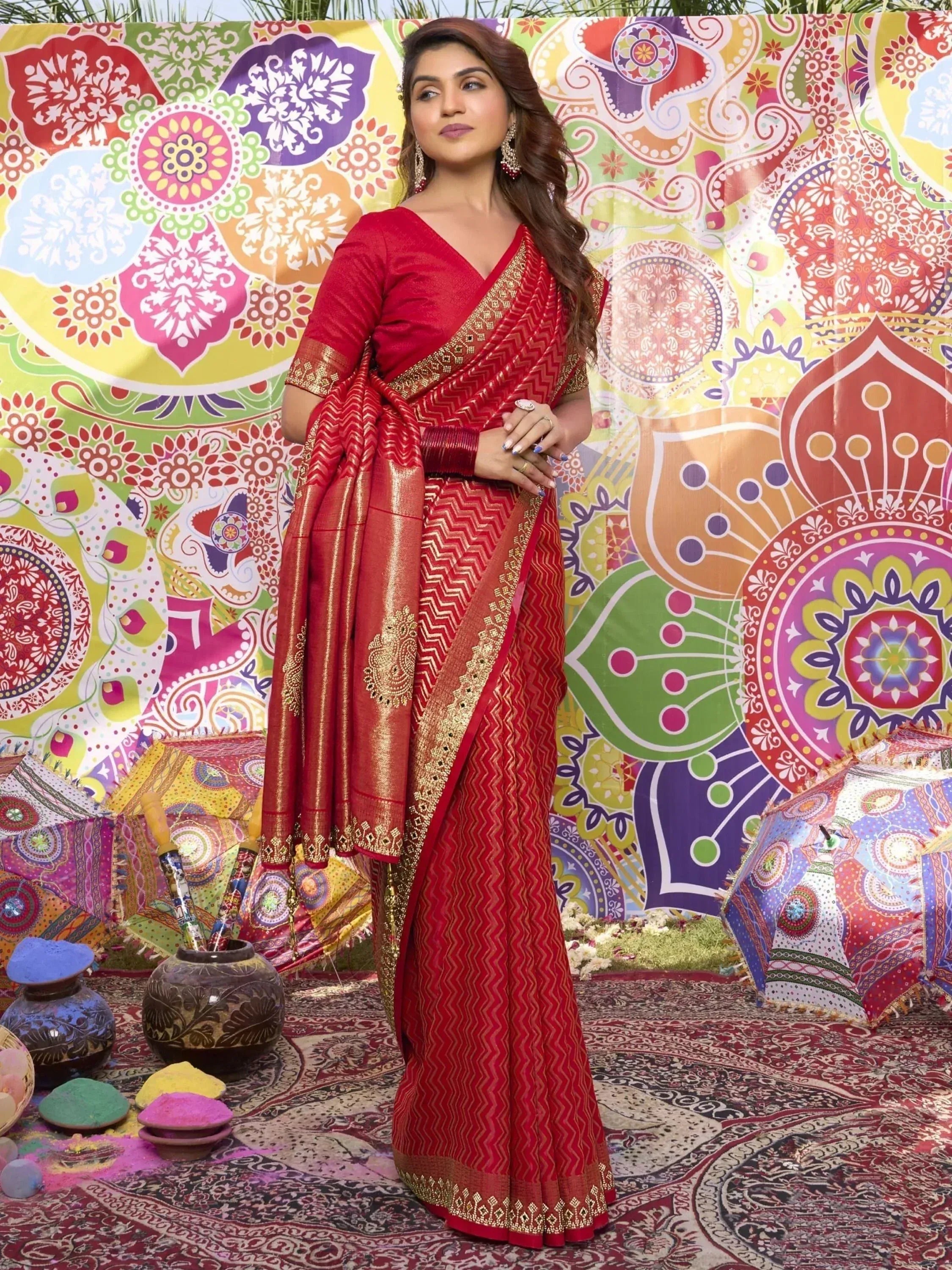Red ethnic saree with gold zari work, perfect for Indian festivals and celebrations