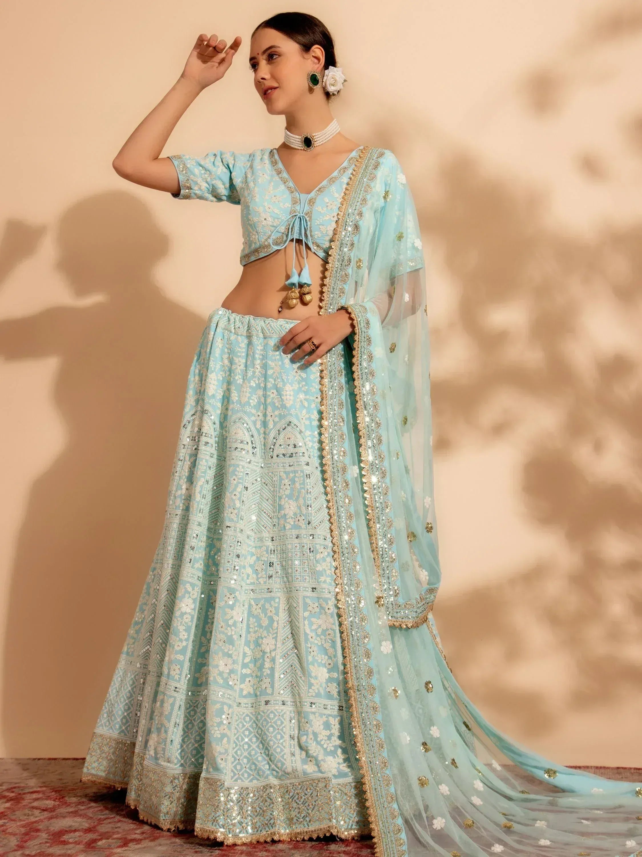 Light blue embroidered lehenga choli with gold detailing, perfect for Indian ethnic occasions