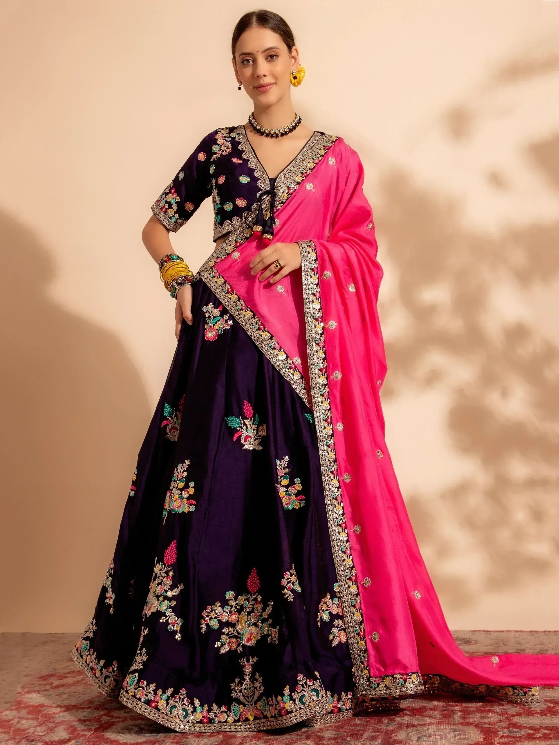Elegant purple lehenga with floral embroidery and pink dupatta, perfect for Indian ethnic wear