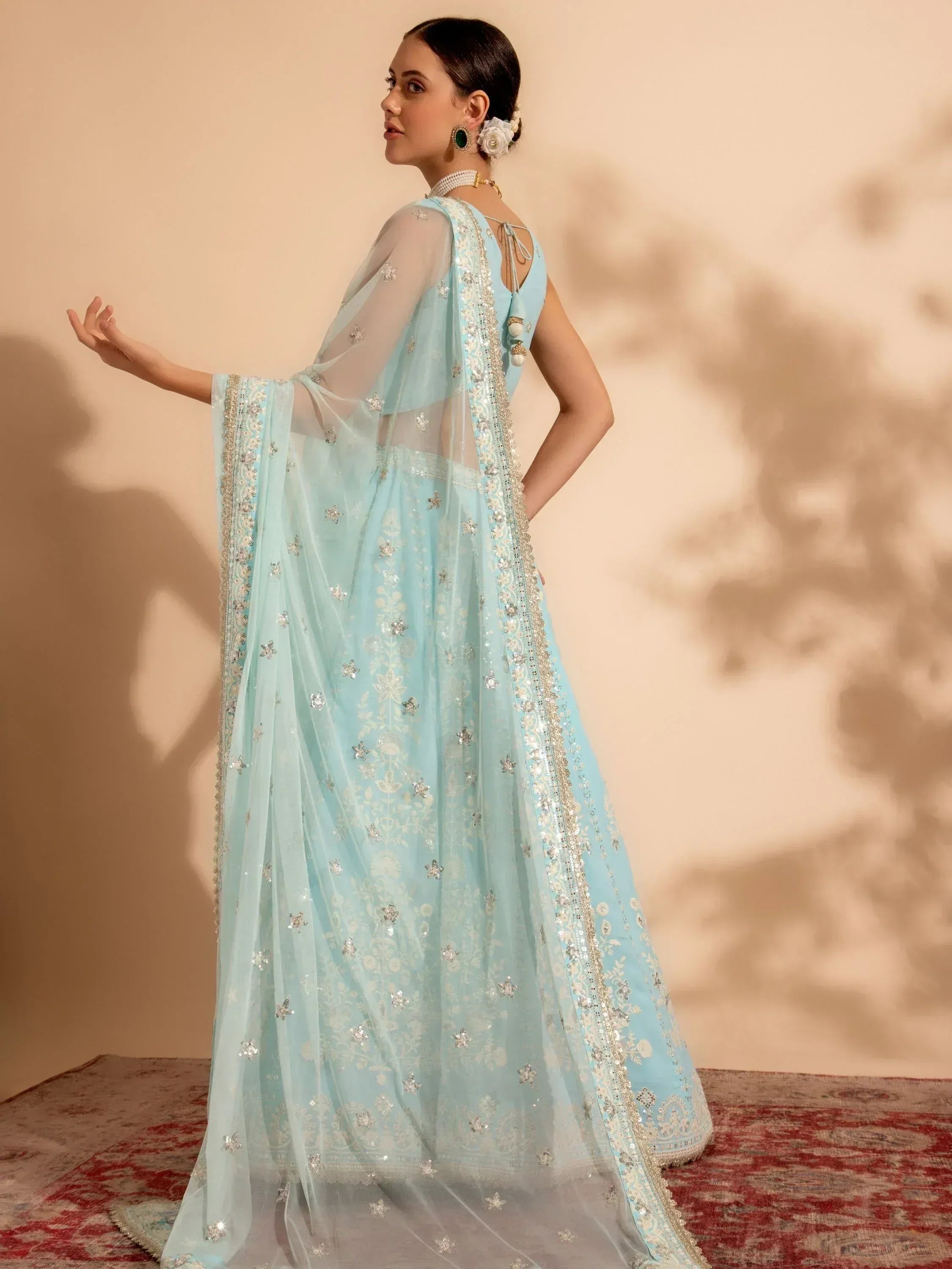 Light blue embroidered ethnic gown with sheer dupatta, perfect for Indian weddings and festive occasions.